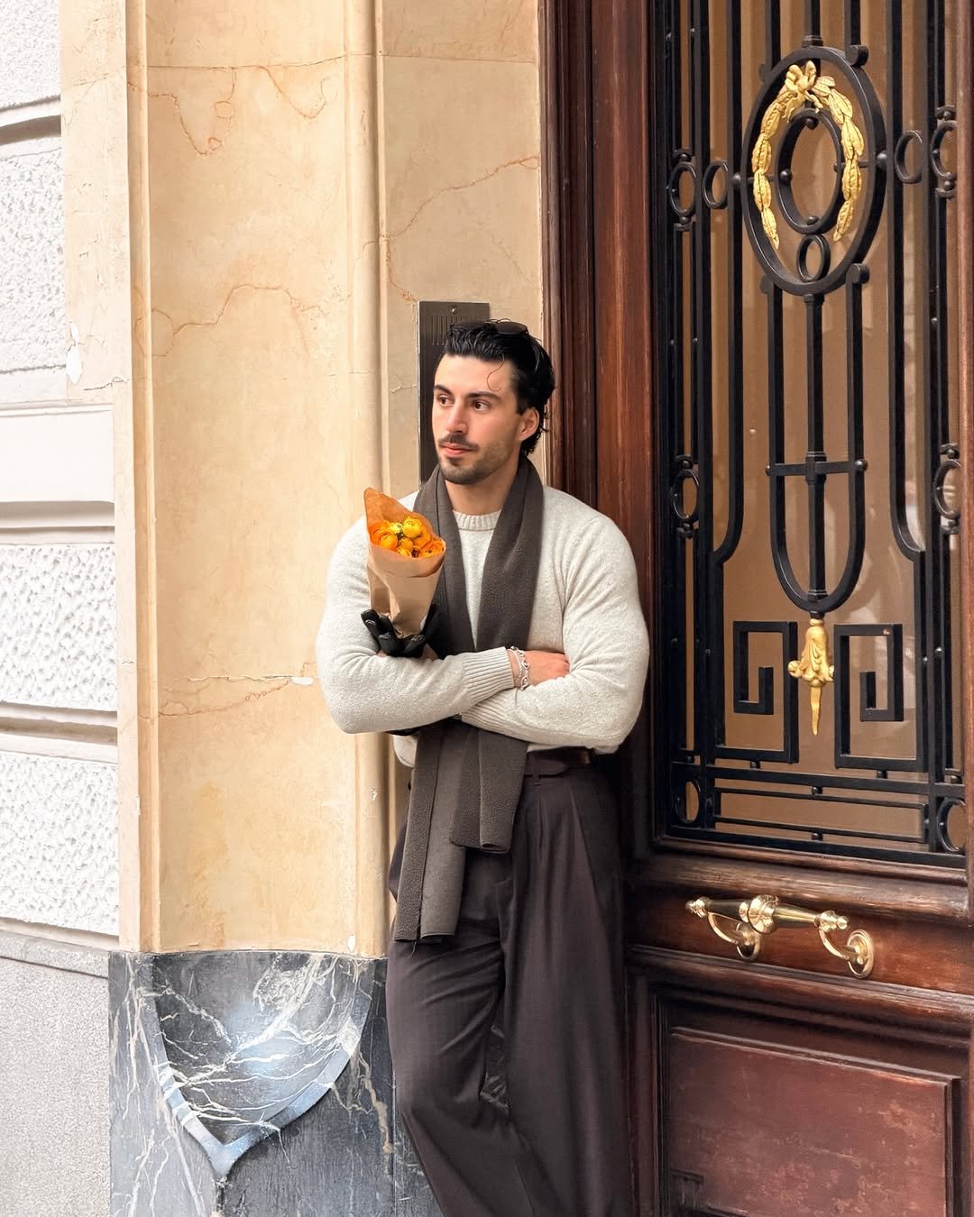 Photo by Nico on February 11, 2026. May be an image of one or more people, beard, people standing, scarf, overcoat, turtleneck, headscarf and text.