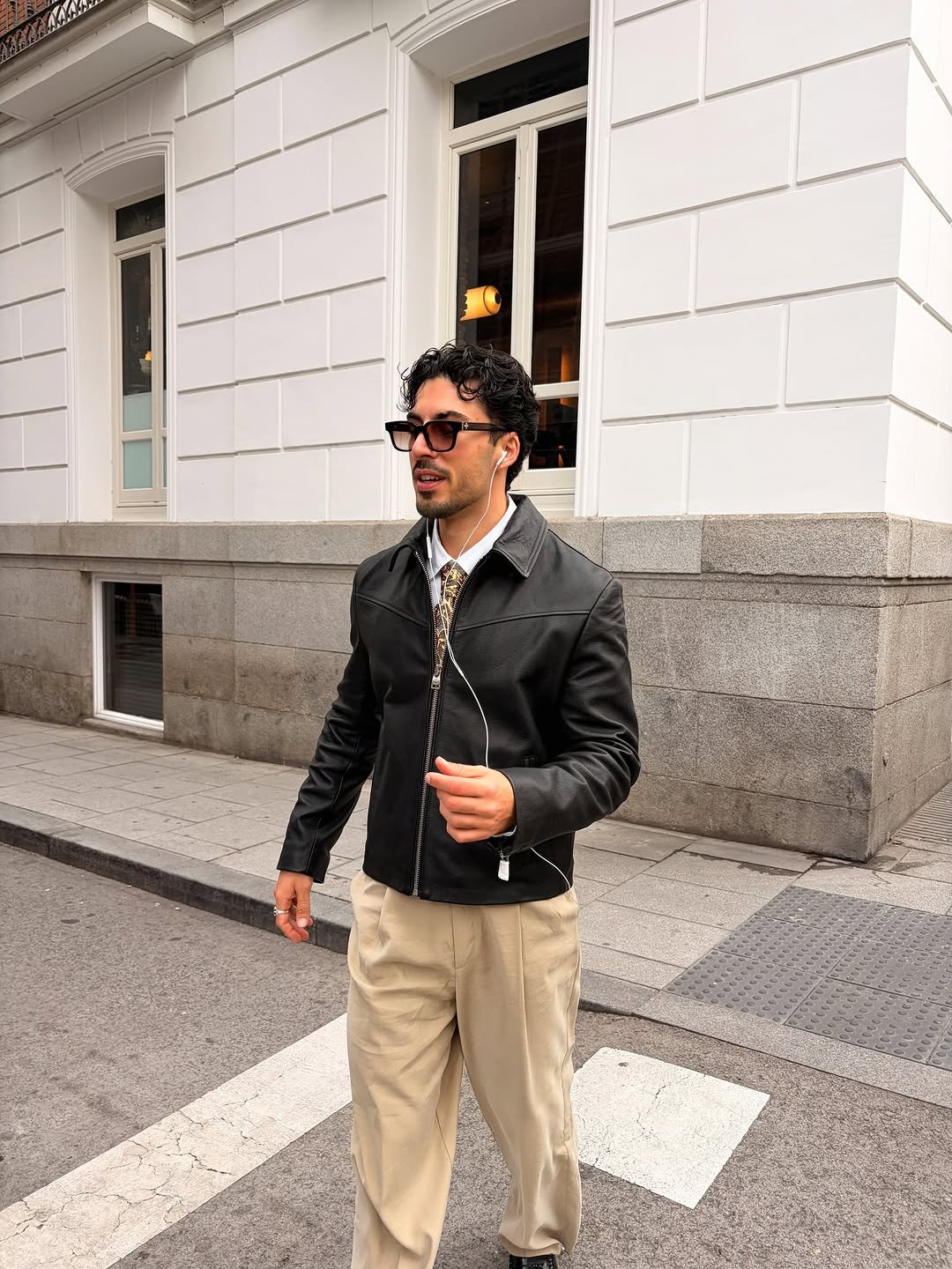 Photo by Nico on November 23, 2025. May be an image of one or more people, wingtip shoes, overcoat, suit and text.