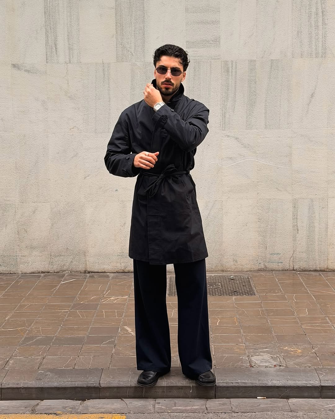 Photo by Nico on February 26, 2026. May be an image of overcoat, suit, apron and text.