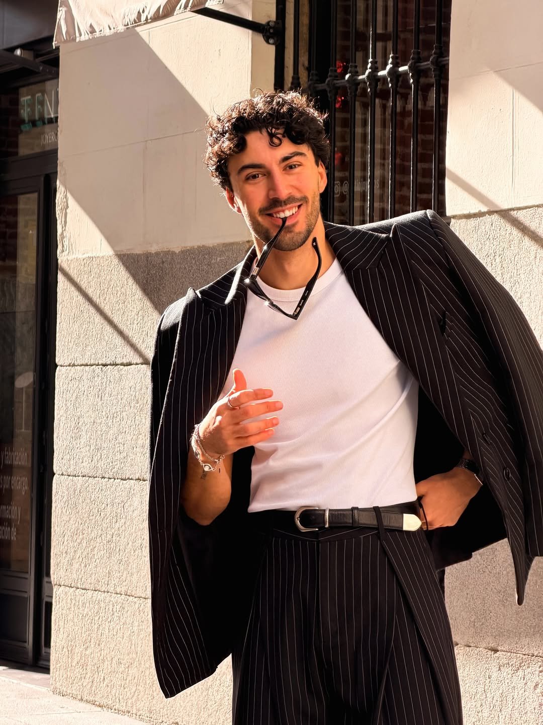 Photo shared by Nico on December 30, 2025 tagging @cainte. May be an image of overcoat, suit, bolo tie, blazer and text.