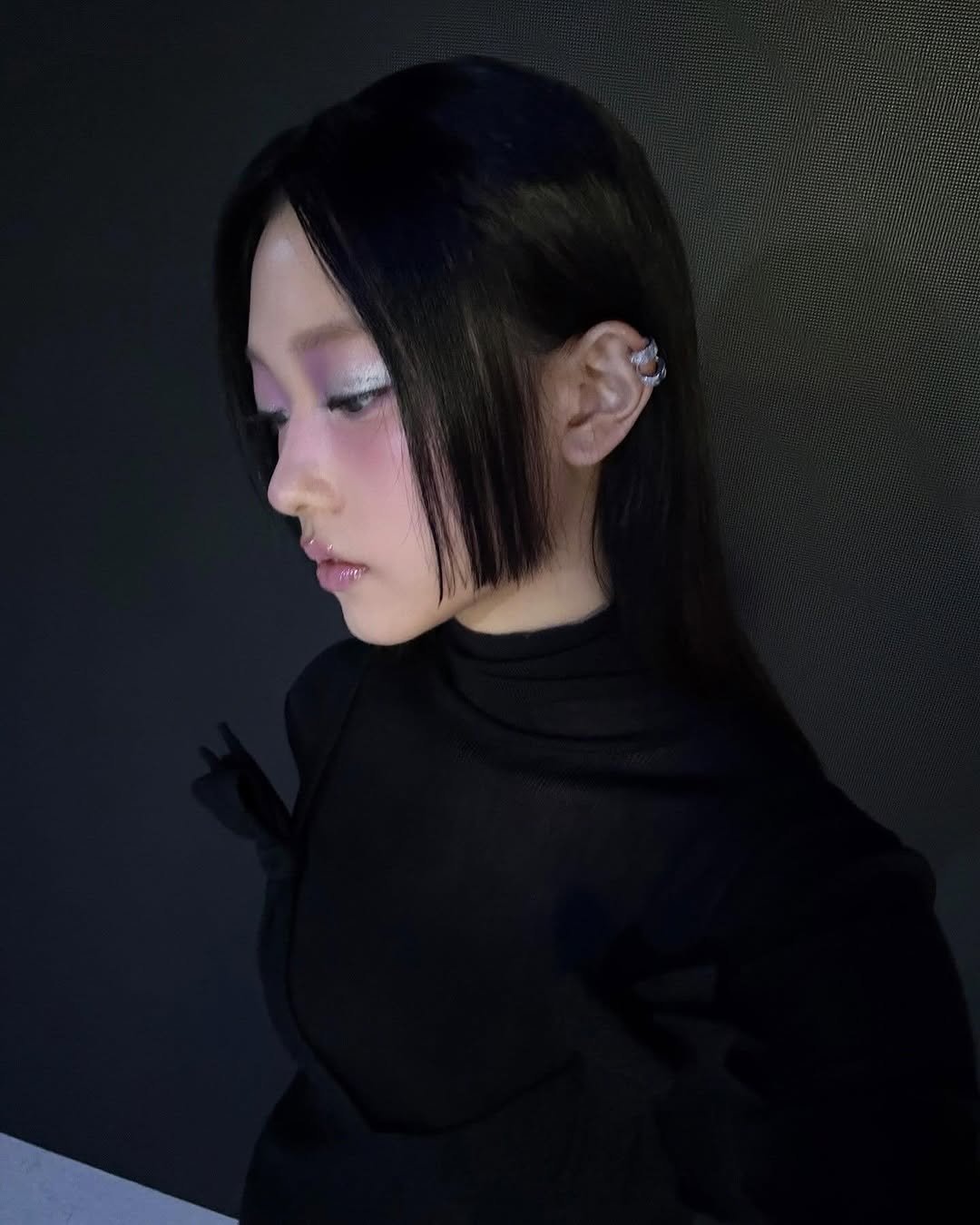 Photo by NJZ HAERIN 해린 on February 21, 2026. May be an image of one or more people, bangs, braids, makeup, top, turtleneck and text.