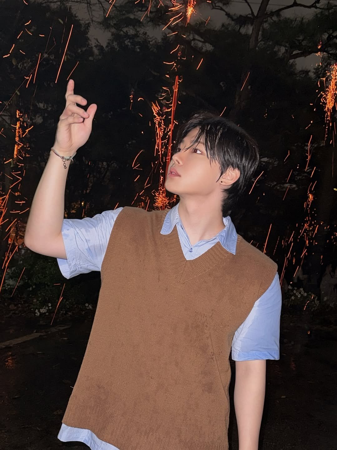 Photo by Park Dong Ju on October 22, 2025. May be an image of one or more people, bangs, fire, sparkler, top, fireworks and text.