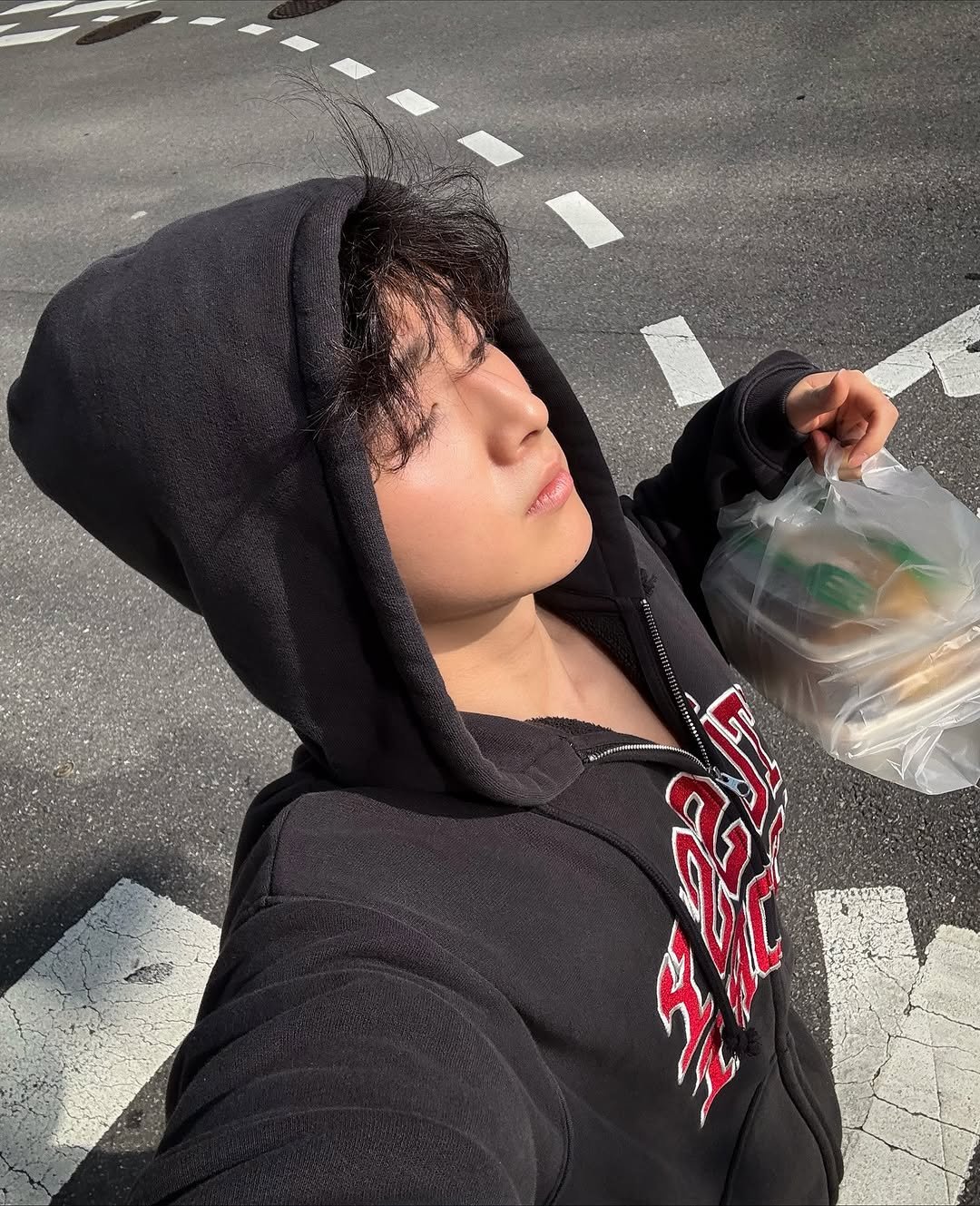 Photo by 노 지 수 on October 24, 2025. May be an image of parka, road, street, curb and text.