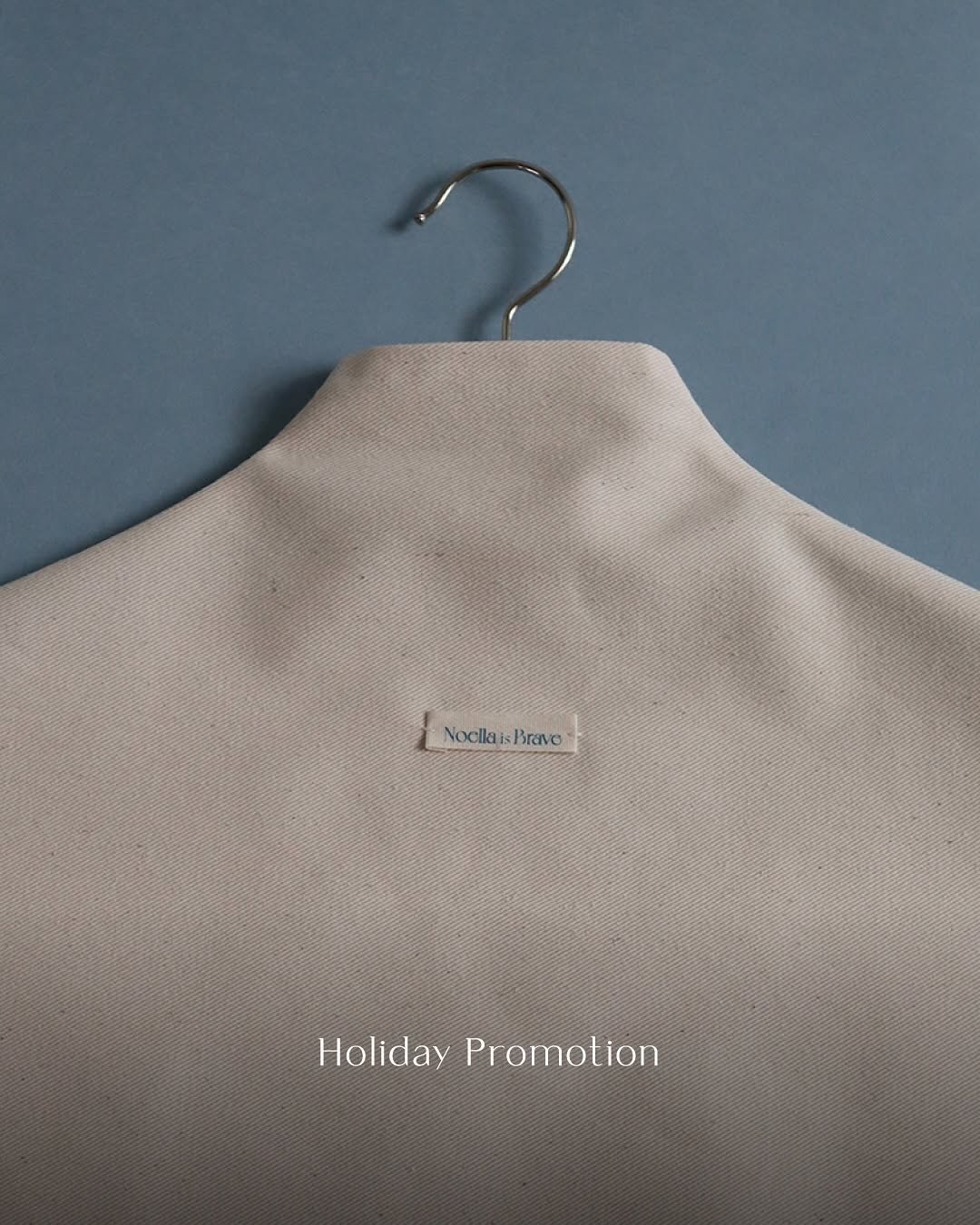 Photo by Noella is Brave on October 03, 2025. May be an image of duffle coat, clothes hanger, turtleneck and text that says 'LNoclakBrane Nocila NocllaisBravo Bravo Holiday HolidayPromotion Promotion'.