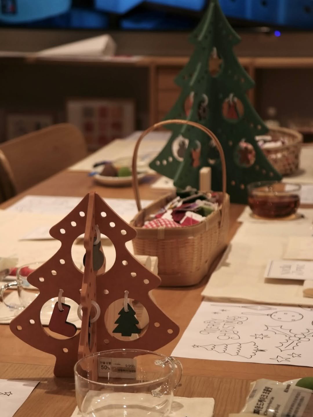 Photo shared by Noella is Brave on December 26, 2025 tagging @mujikr_openmuji. May be an image of gingerbread cookie, christmas tree, placemat and text.