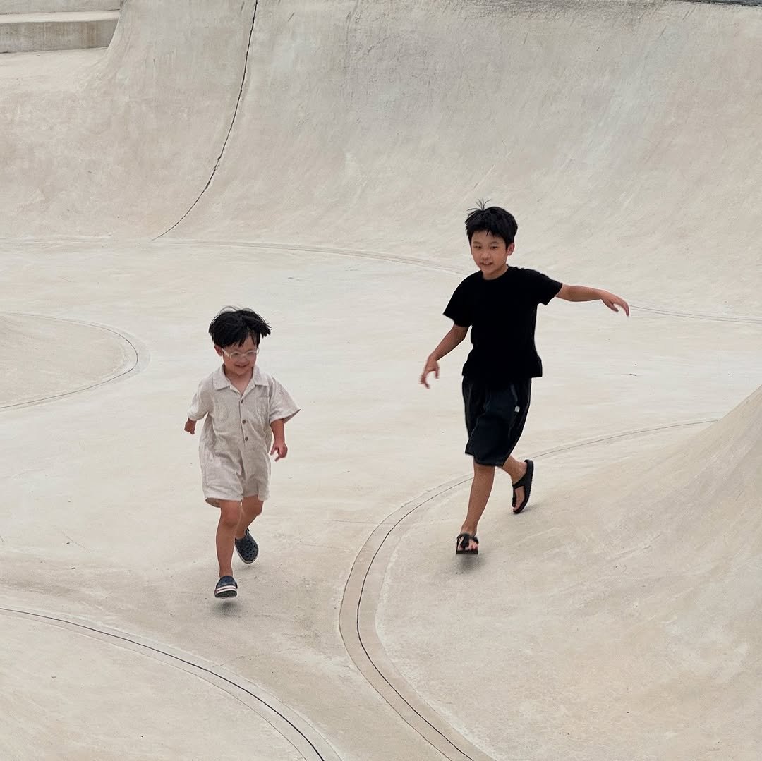 Photo by MJ Bang on August 11, 2025. May be an image of 2 people, child, skateboard and text.