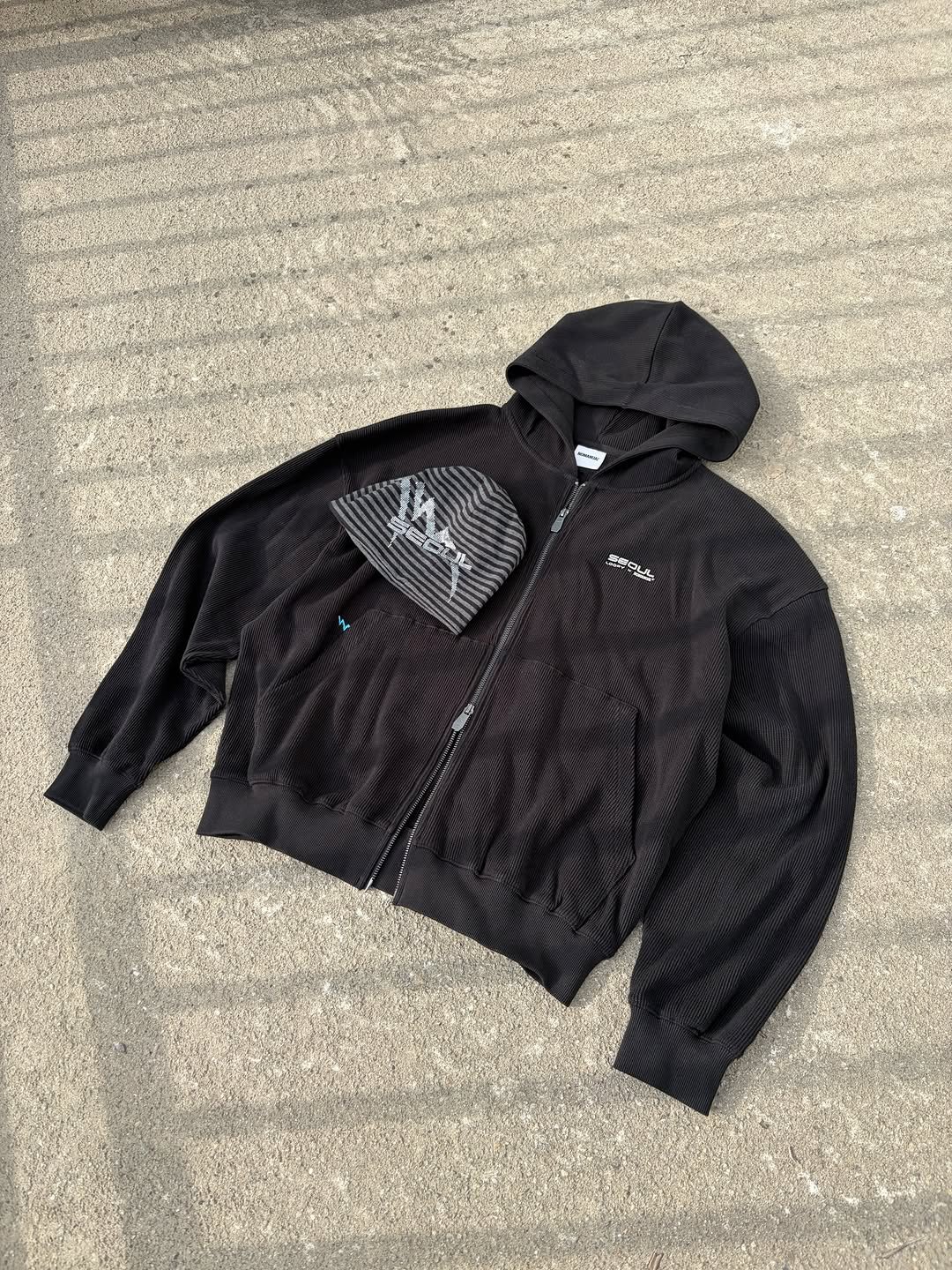 Photo shared by NOMANUAL® on January 11, 2026 tagging @thisloop. May be an image of coat, fleece, parka, flight jacket and text.