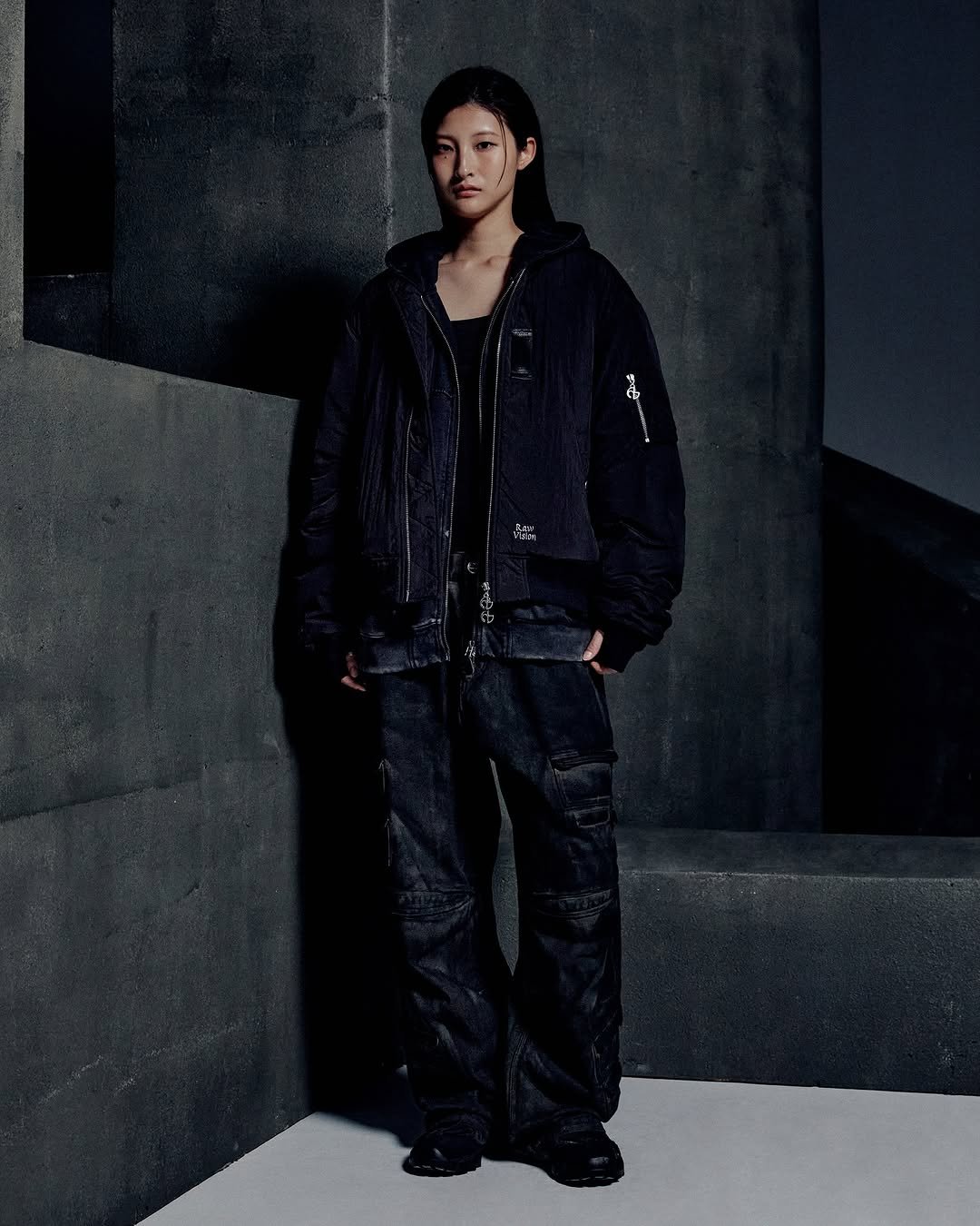 Photo by NOMANUAL® on August 04, 2025. May be an image of 1 person, duffle coat, jacket, parka and text.
