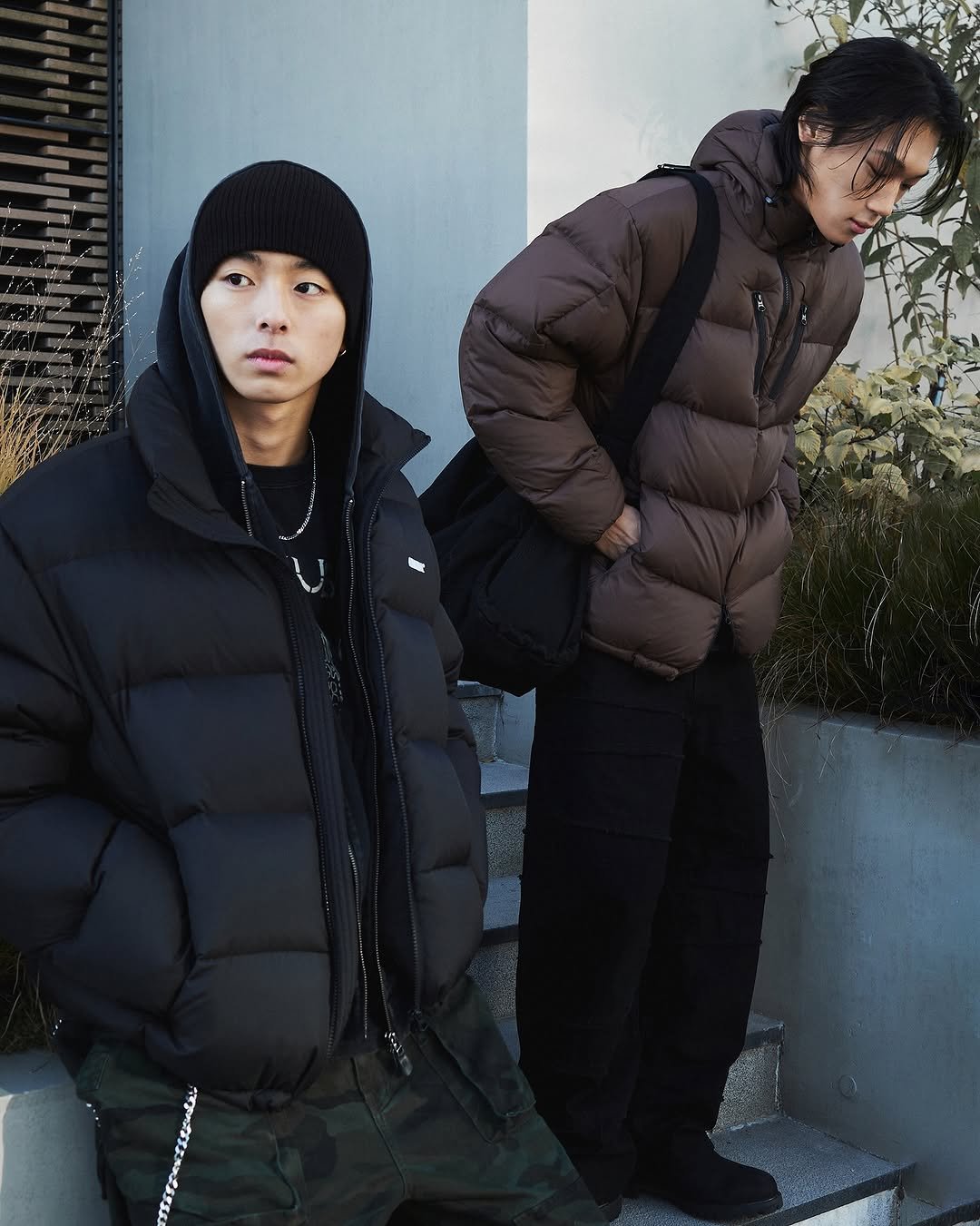 Photo by NOMANUAL® on November 17, 2025. May be an image of overcoat, goosedown coat, duffle coat, sweatpants, military uniform, parka, face mask and text.