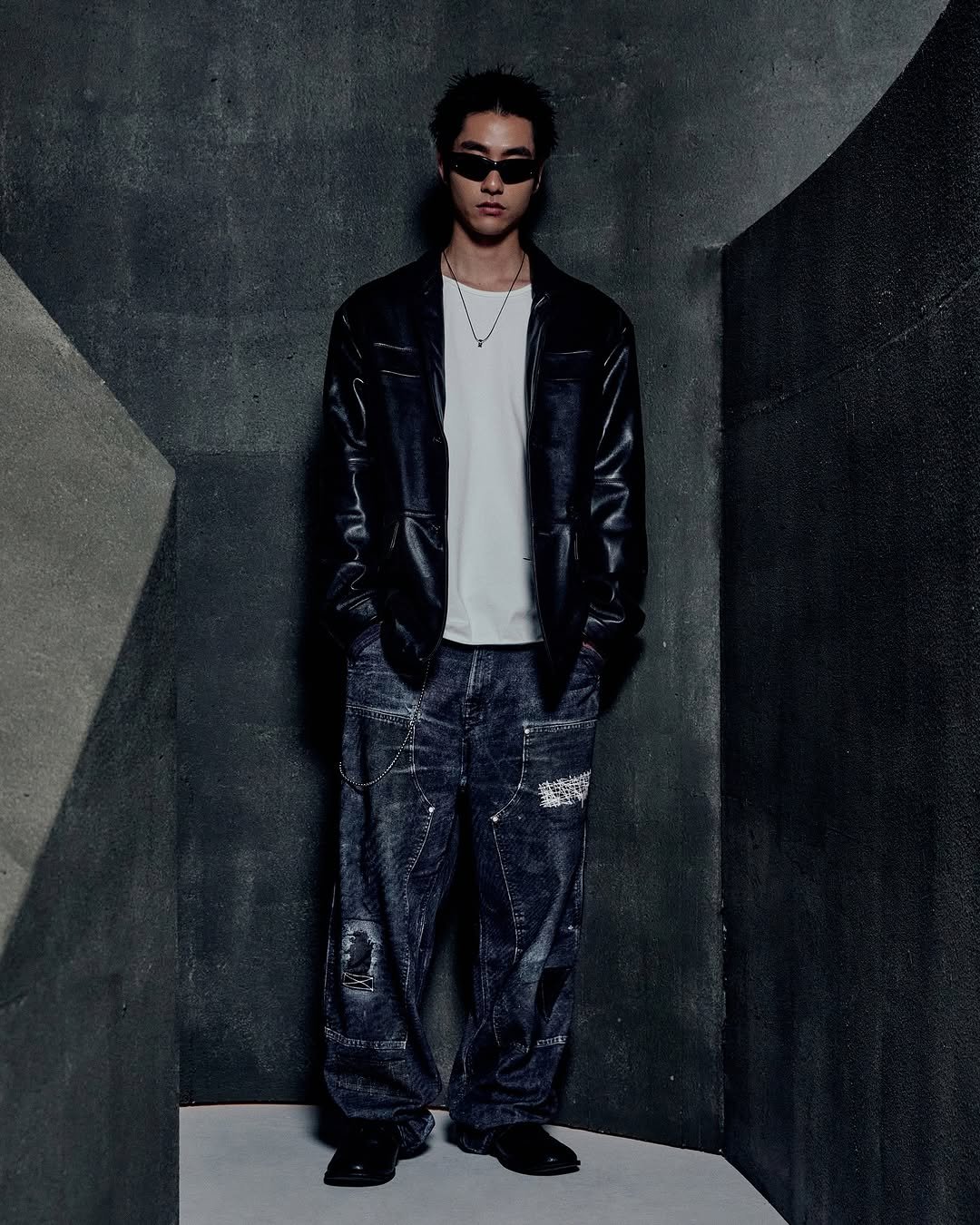 Photo by NOMANUAL® on August 04, 2025. May be an image of 1 person, bangs, eyewear, top, outerwear, sweatpants and text.