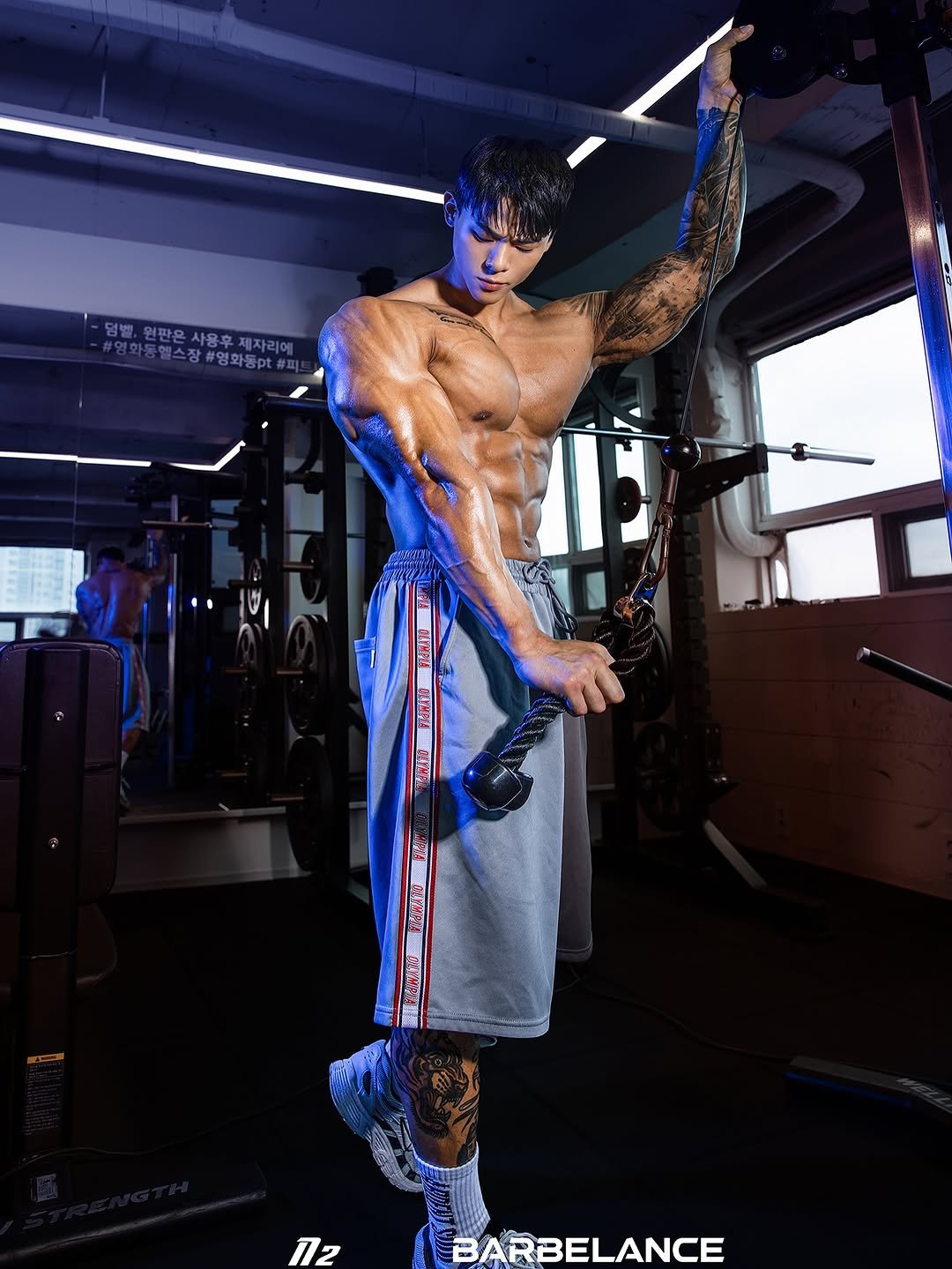 Photo shared by 박요한 (논난이) on November 26, 2025 tagging @n2studio_kwon, and @barbelance. May be an image of one or more people, biceps, sportswear and poster.