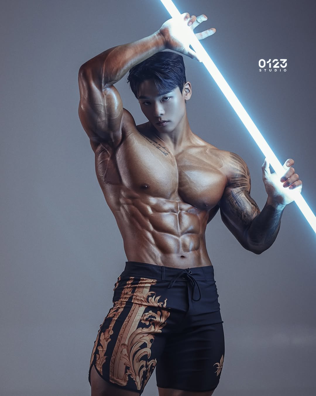 Photo shared by 박요한 (논난이) on September 08, 2025 tagging @0123studio, and @carmid.kr. May be an image of 1 person, biceps, body building, poster, sword, costume, sportswear and text that says '0123 STUDIO ries All'.