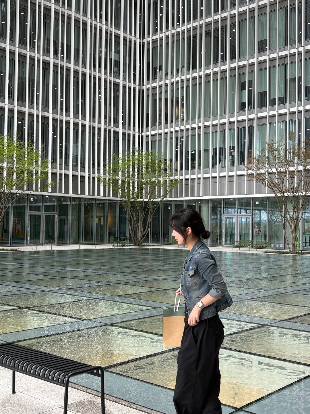 Photo by 눈더 on April 02, 2026. May be an image of suit, street, buildings and text.