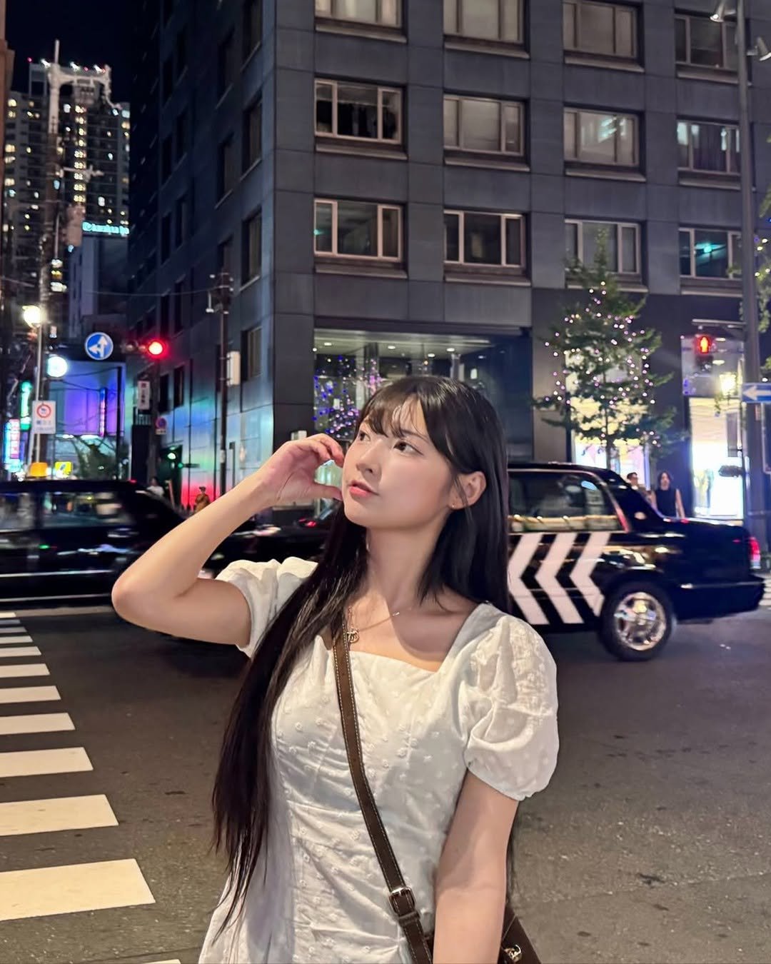 Photo shared by YouTube on December 06, 2025 tagging @o_dahye_o. May be an image of one or more people, hair, Times Square, street, night and text.