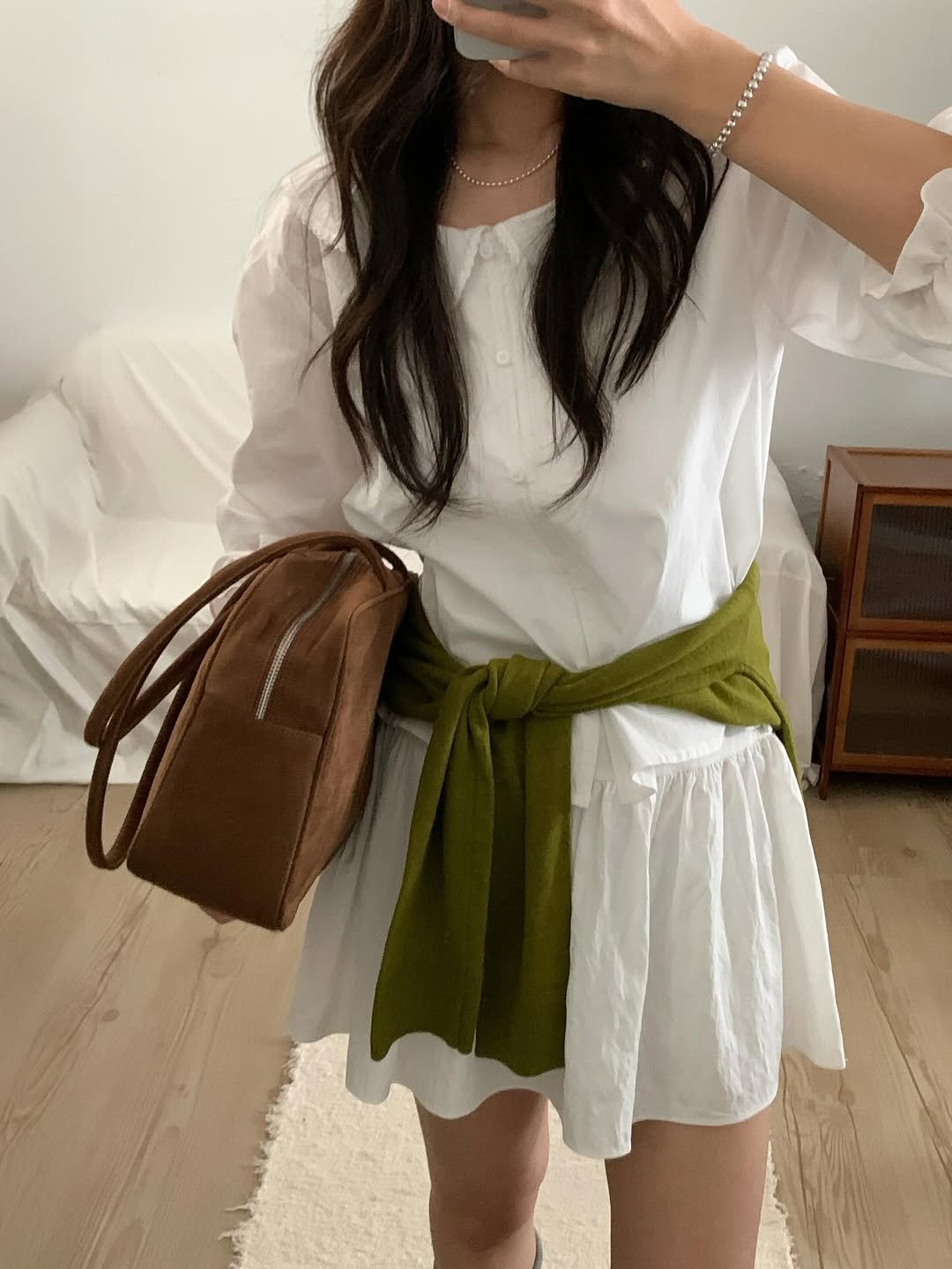 Photo by 오베럴 | obetter on February 23, 2026. May be an image of skirt, drawstring, dress and text.