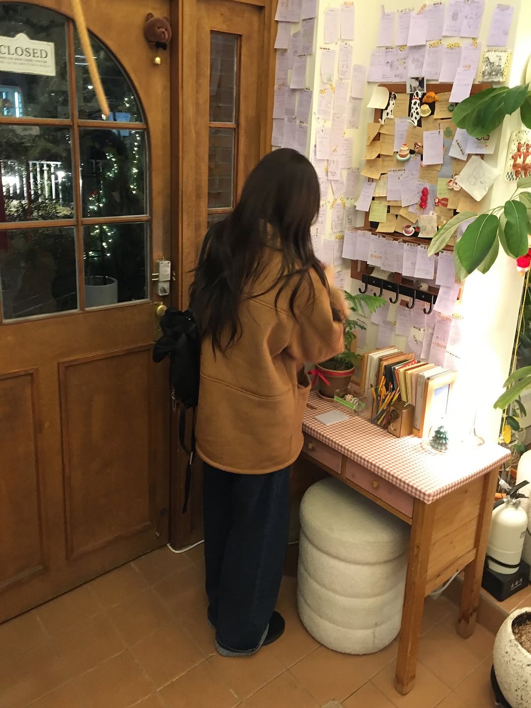 Photo by 오베럴 | obetter on November 23, 2025. May be an image of duffle coat, wind chime, cabinet, pot, door and text.