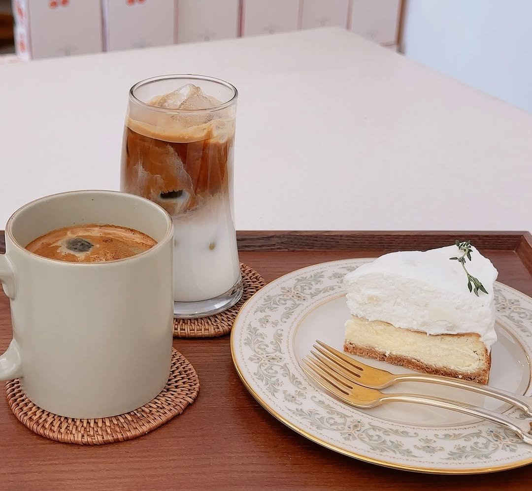 Photo by OF Oui 오브위 on April 09, 2026. May be an image of cake, coffee cup, cheesecake, whipped cream, placemat, pie and text.