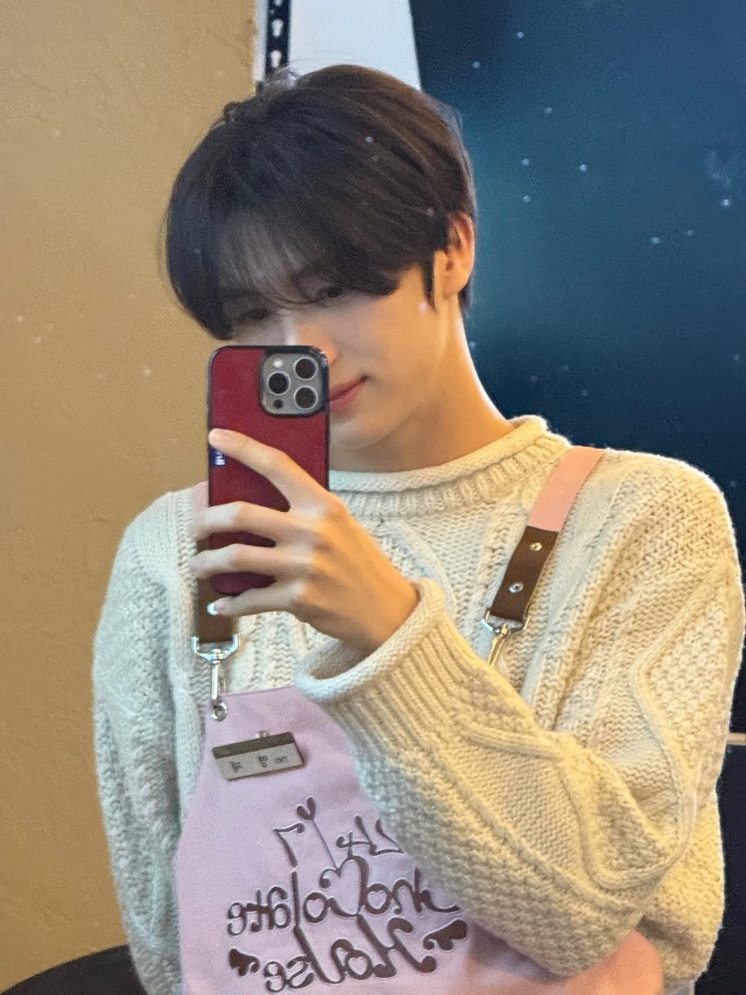 Photo by TWS 투어스 FANPAGE on February 05, 2026. May be an image of sweater, turtleneck, sweatshirt and text.