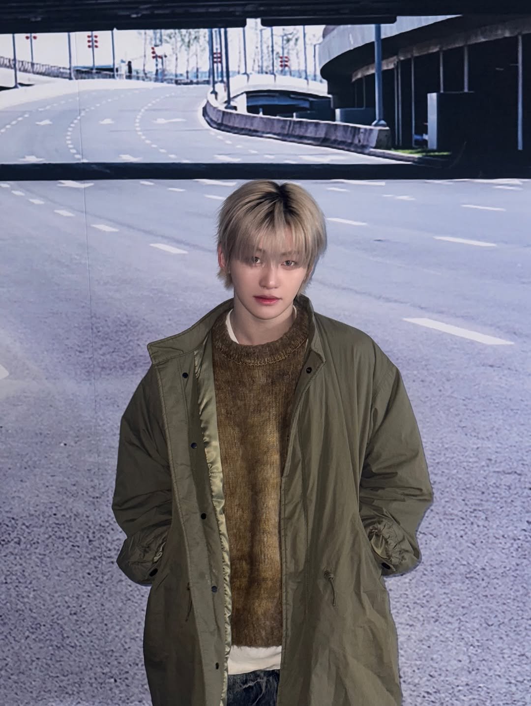 Photo by TWS 투어스 FANPAGE on March 15, 2026. May be an image of duffle coat, overcoat, parka, jacket and text.