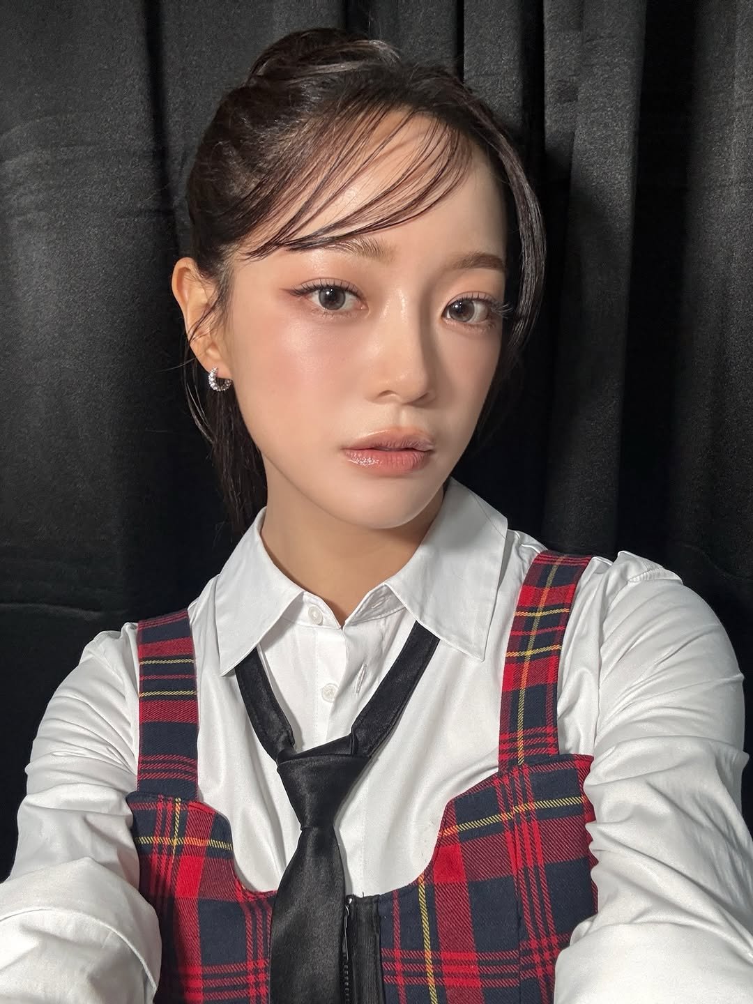 Photo shared by 김세정 (KIM SEJEONG) on January 11, 2026 tagging @clean_0828. May be an image of one or more people, hair, bolo tie and text.