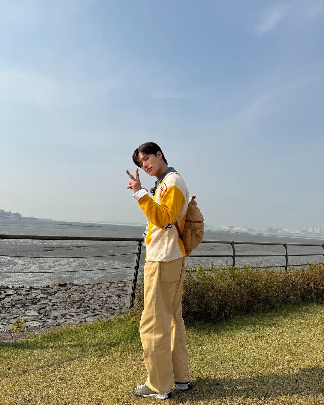 Photo by 몬스타엑스 MONSTA X on January 02, 2026. May be an image of duffle coat, ocean and text.