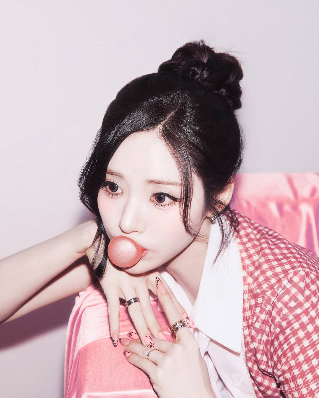 Photo shared by fromis_9 [프로미스나인] on March 24, 2026 tagging @xjiwonparkx. May be an image of one or more people, hair, makeup, people chewing bubblegum and text.