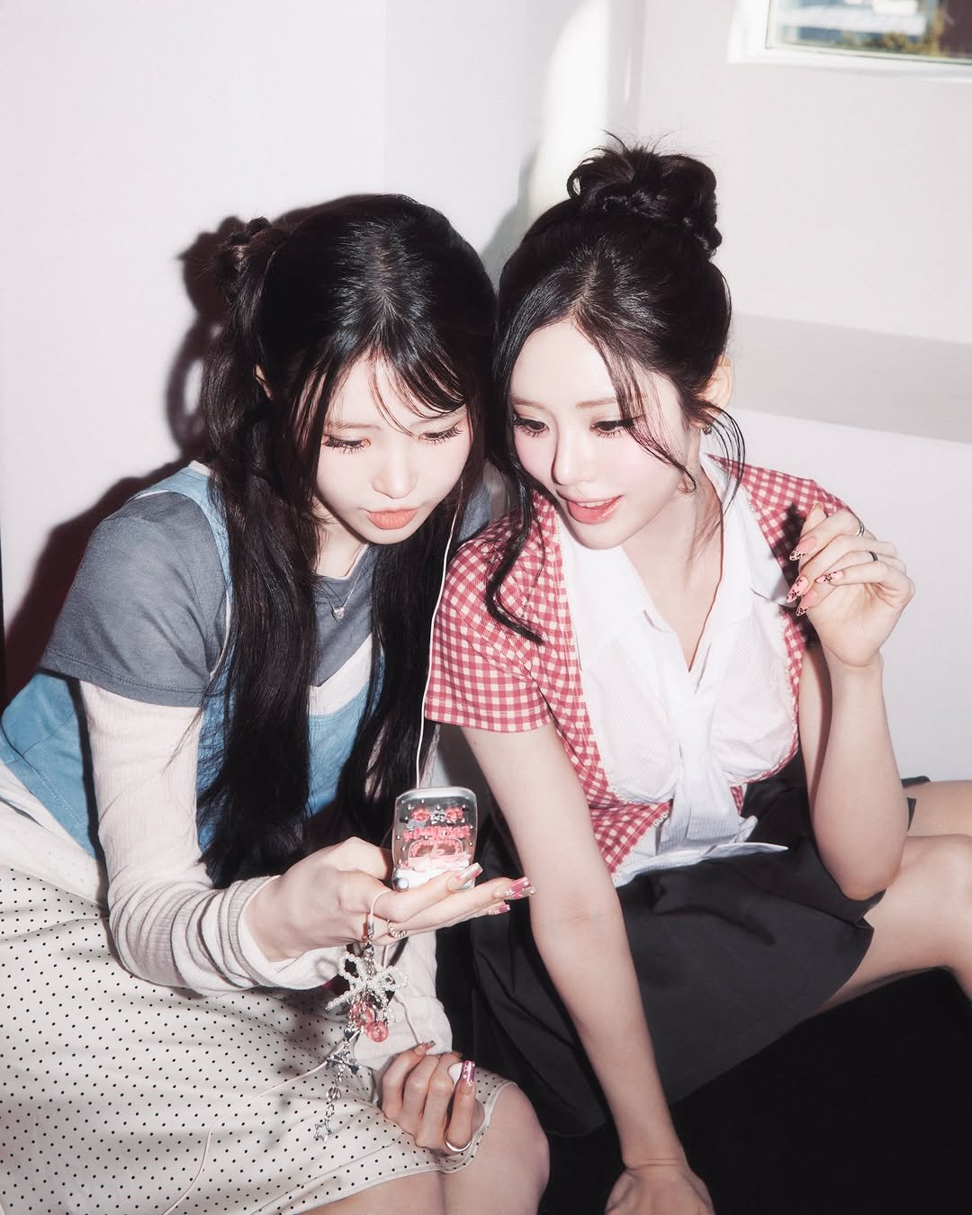 Photo shared by fromis_9 [프로미스나인] on March 20, 2026 tagging @xjiwonparkx, and @shy9_29. May be an image of one or more people, hair and text.