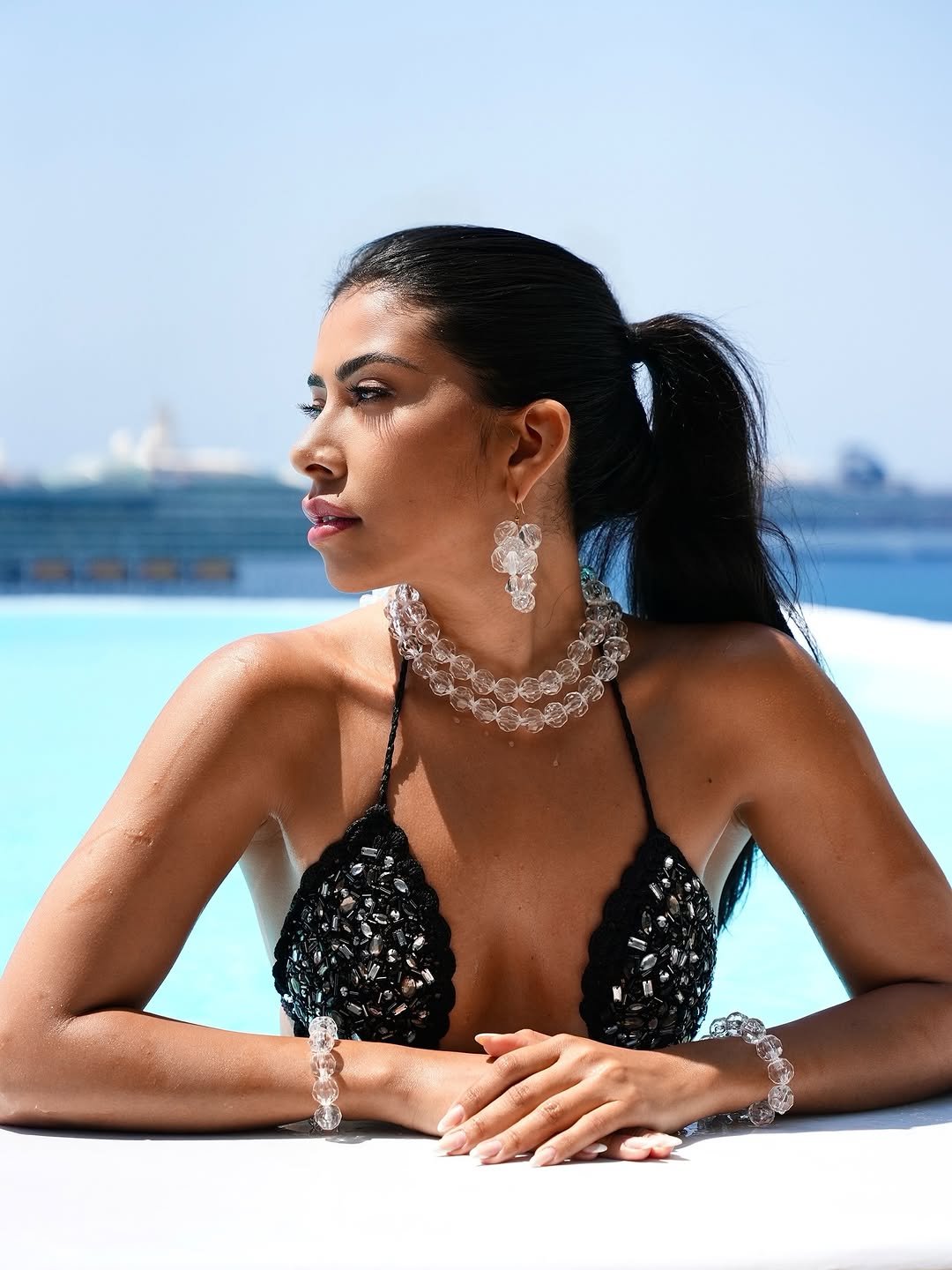 Photo shared by Ingrid Ohara on August 14, 2025 tagging @cavotagoomykonos, and @nicktheonly. May be an image of 1 person, jewelry and pool.