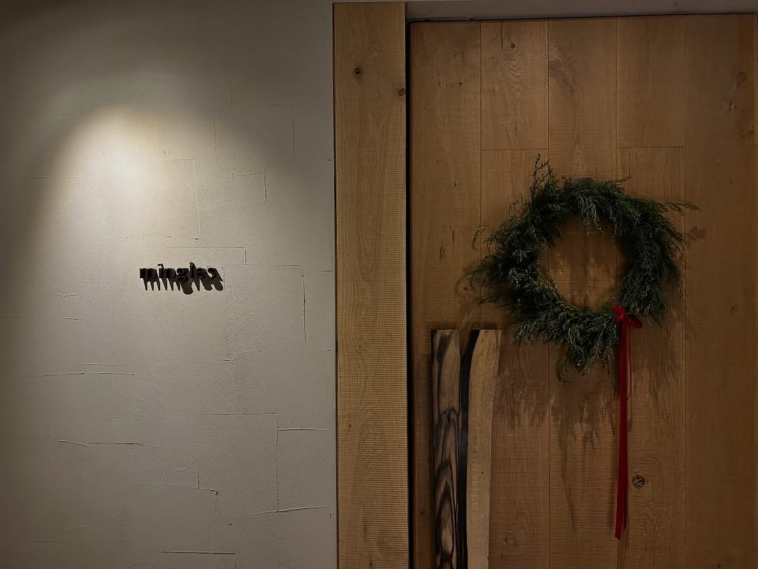 Photo shared by 하늘 민 고울 선 on December 22, 2025 tagging @mingles_restaurant. May be an image of lightbulb, barn door, door and text.