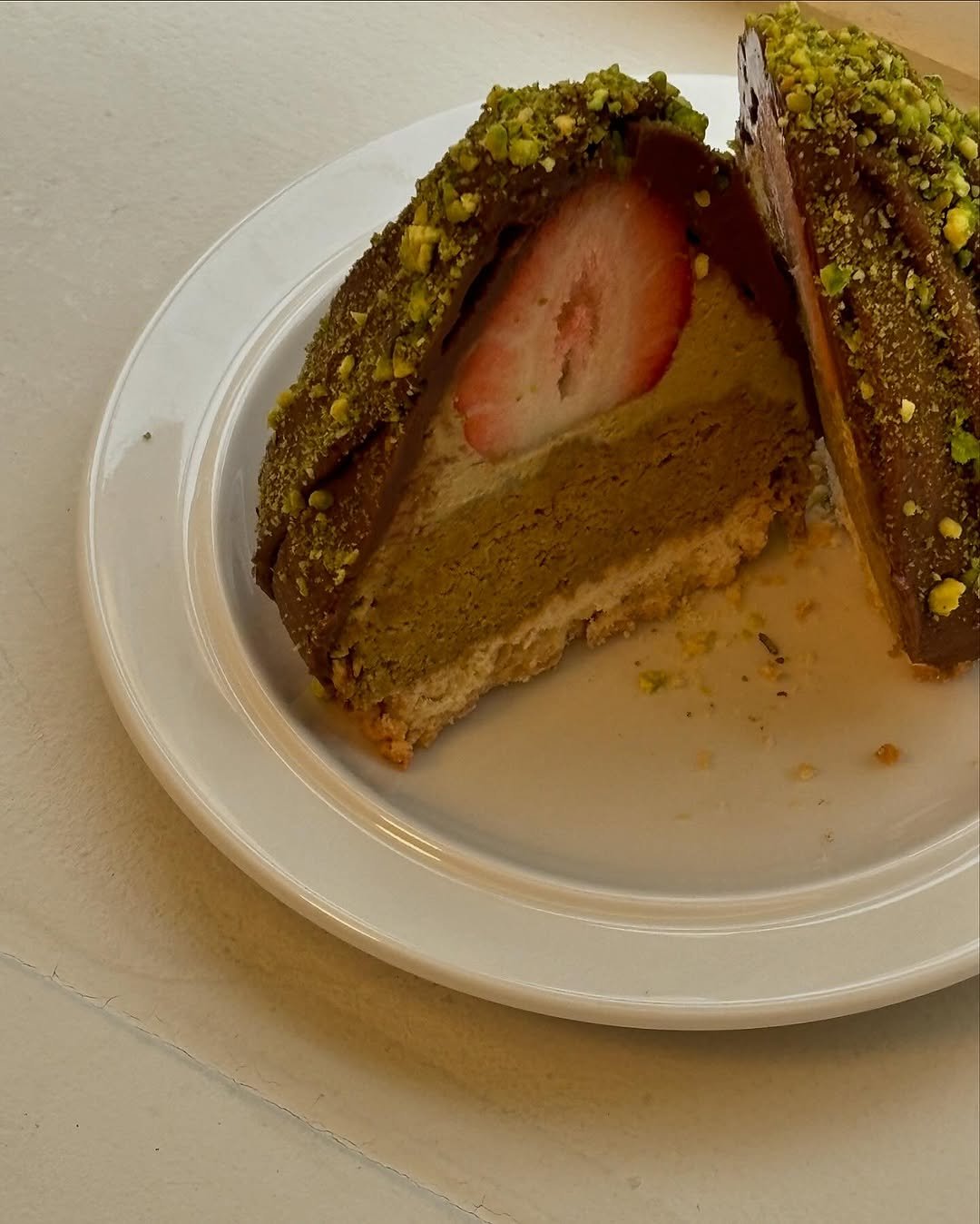 Photo by 리브인오후 on December 23, 2025. May be an image of cake, strawberry, tart and text.