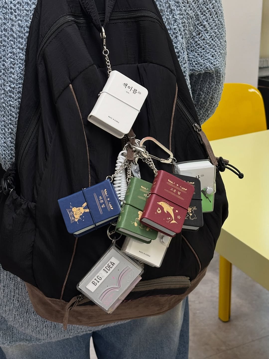 Photo shared by 오이뮤 / OIMU® on September 23, 2025 tagging @oimu_. May be an image of 1 person, tool bag, suitcase, briefcase, drawstring, pouch, sling, luggage, purse and text.