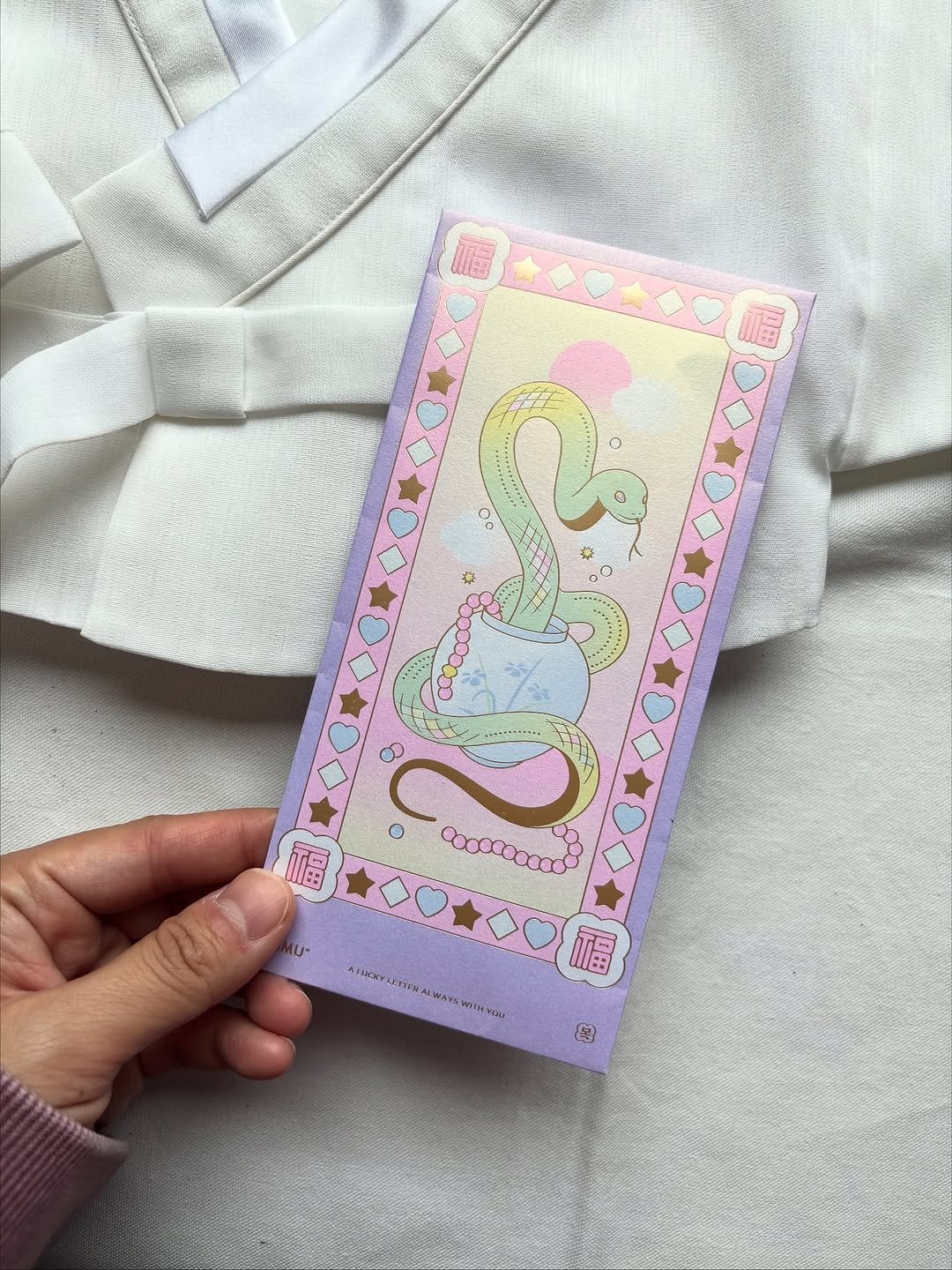 Photo by 오이뮤 / OIMU® on November 08, 2025. May be an illustration of sleepwear, diary, bath robe, robe, card and text.