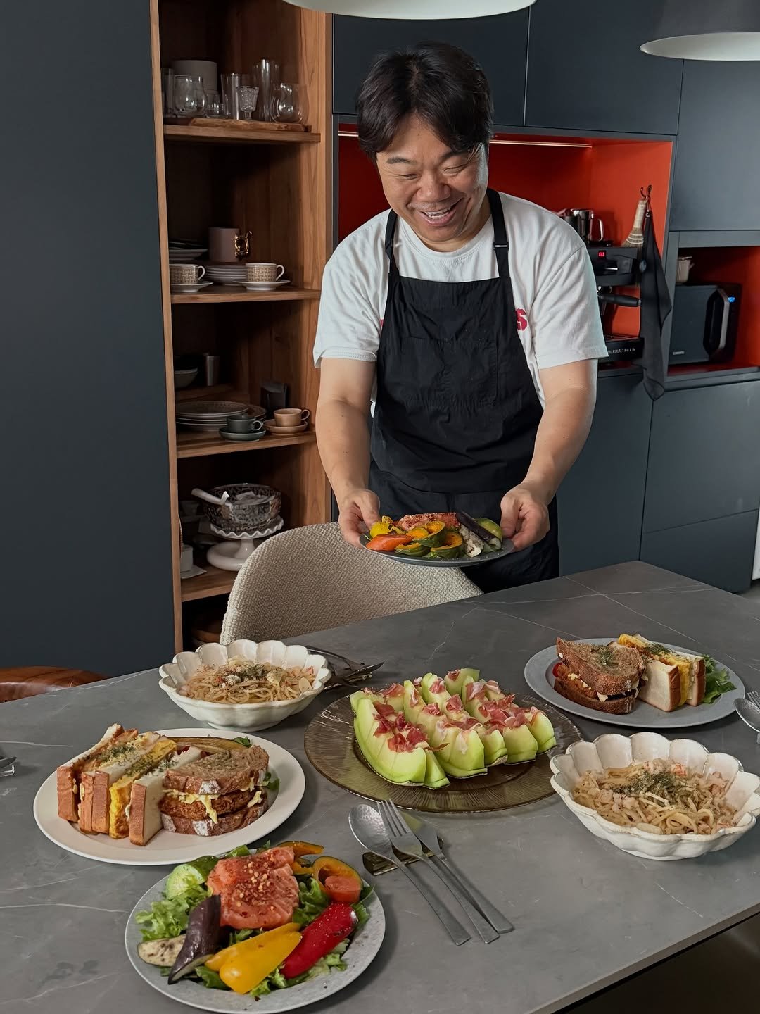 Photo by 옥주부 on September 27, 2025. May be an image of 1 person, cutlery, apron, chopsticks, cooker and text.