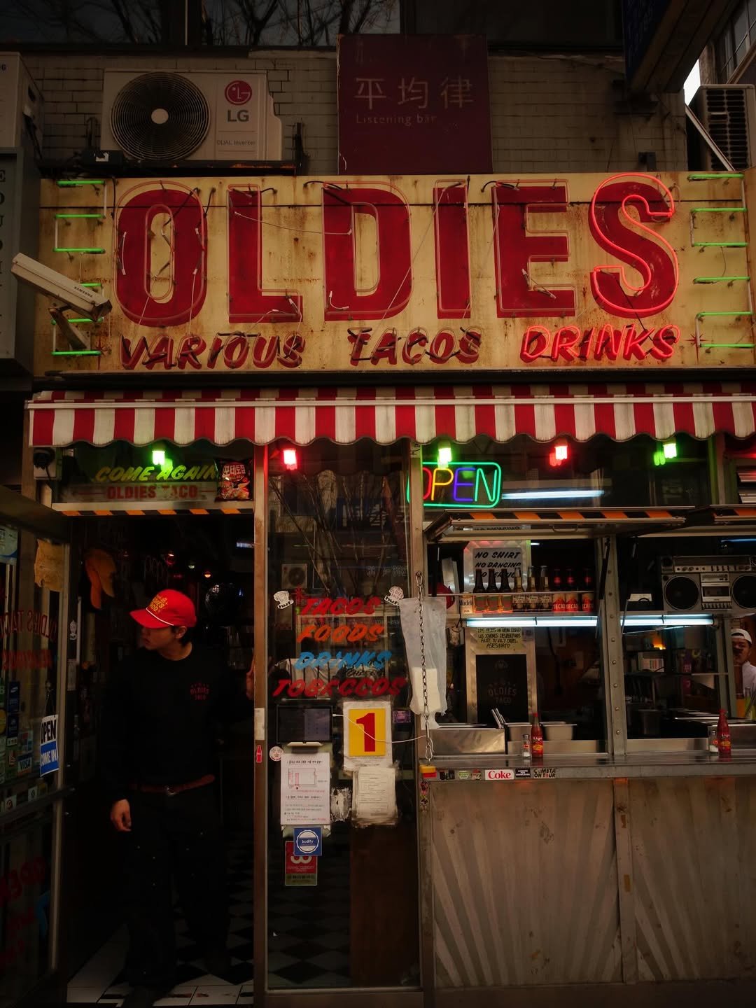 Photo shared by @emmelens_ on April 05, 2026 tagging @oldiestaco. May be an image of hotdog, signboard and text.