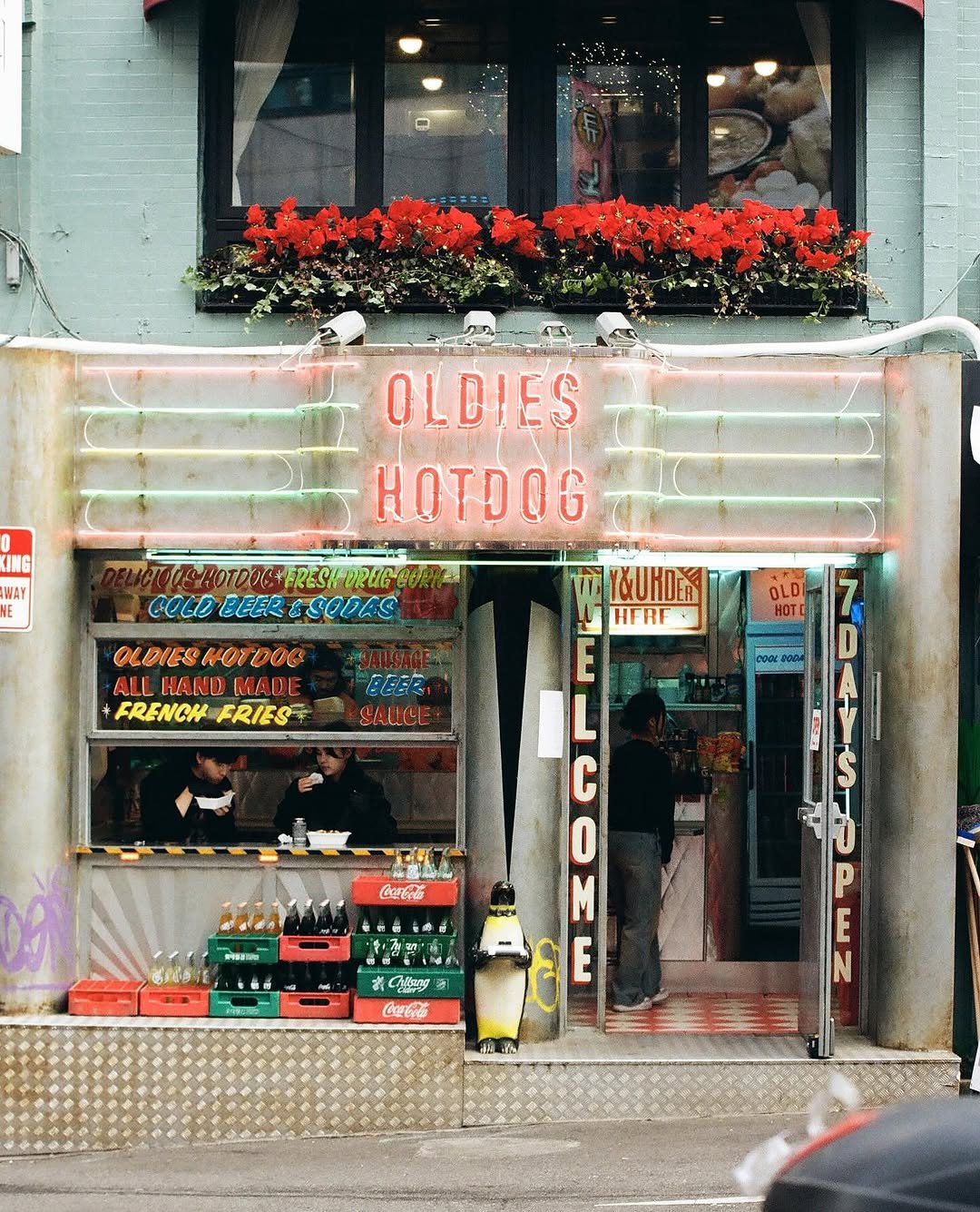 Photo shared by 올디스 타코 on July 15, 2025 tagging @jakejack_hotdog. May be an image of 3 people, signboard and text.