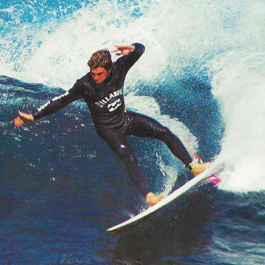 Photo by Aloha on February 21, 2026. May be an image of surfboard, wetsuit, water and text.