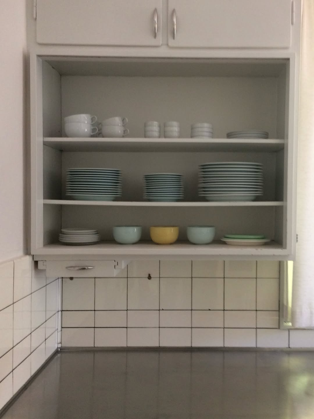 Photo by 오늘영 on September 28, 2025. May be an image of plate rack, cabinet, shelf, kitchen and text.