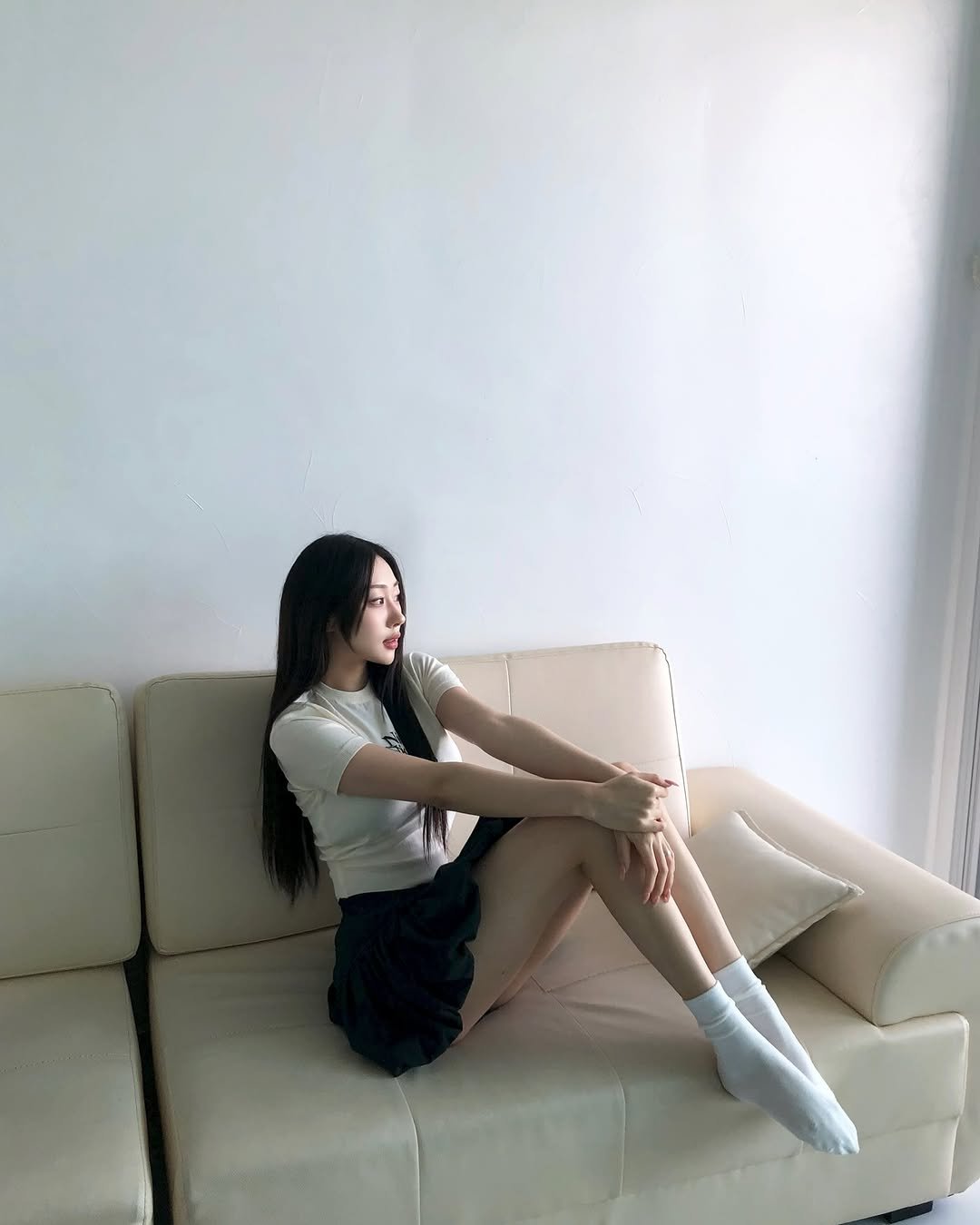 Photo by 장진원 JINWON on May 07, 2025. May be an image of 1 person, long hair, chaise lounge and text.