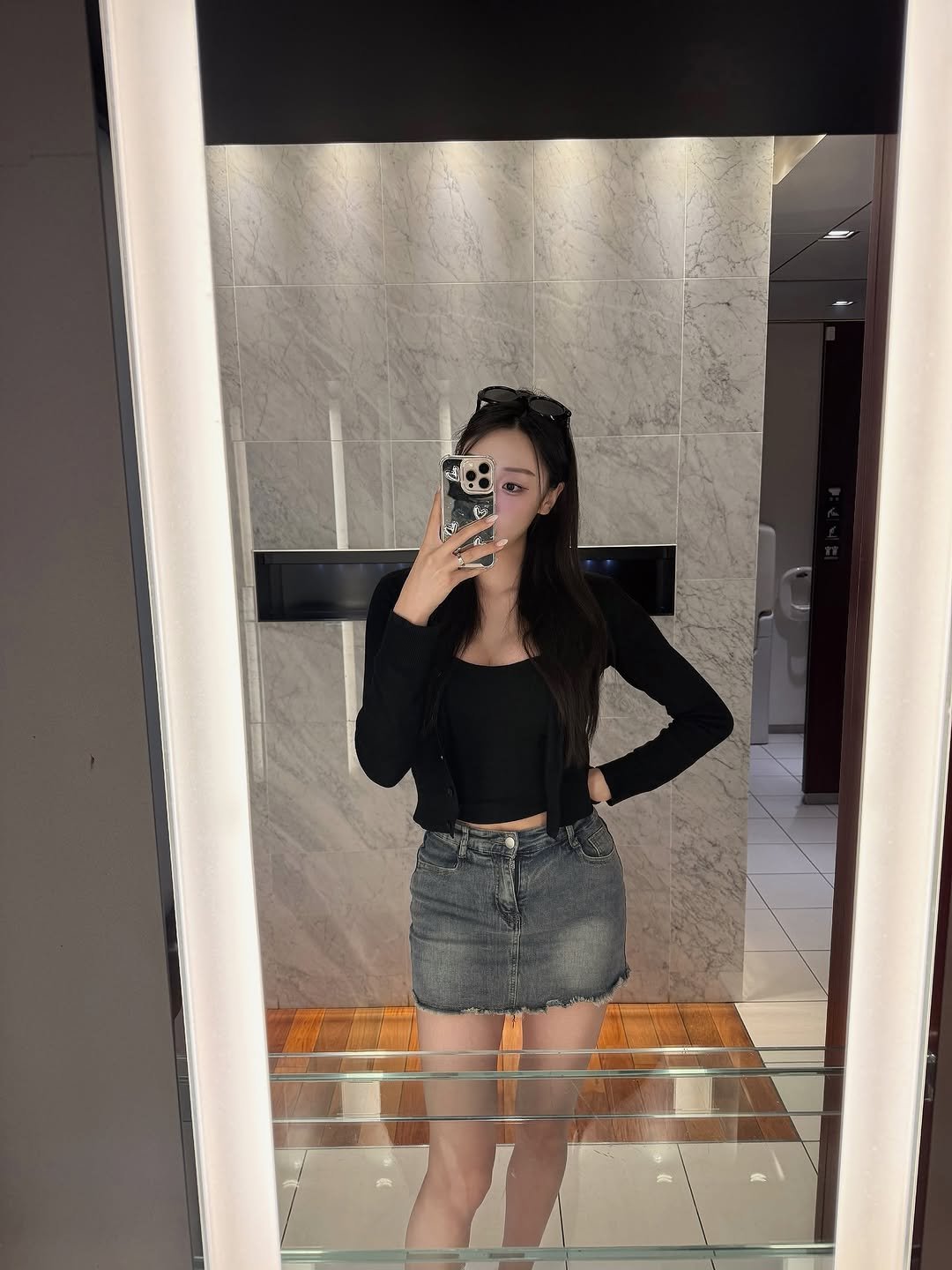 Photo by 장진원 JINWON on June 08, 2025. May be a selfie of 1 person, mirror, shorts, skirt, top, miniskirt and text.