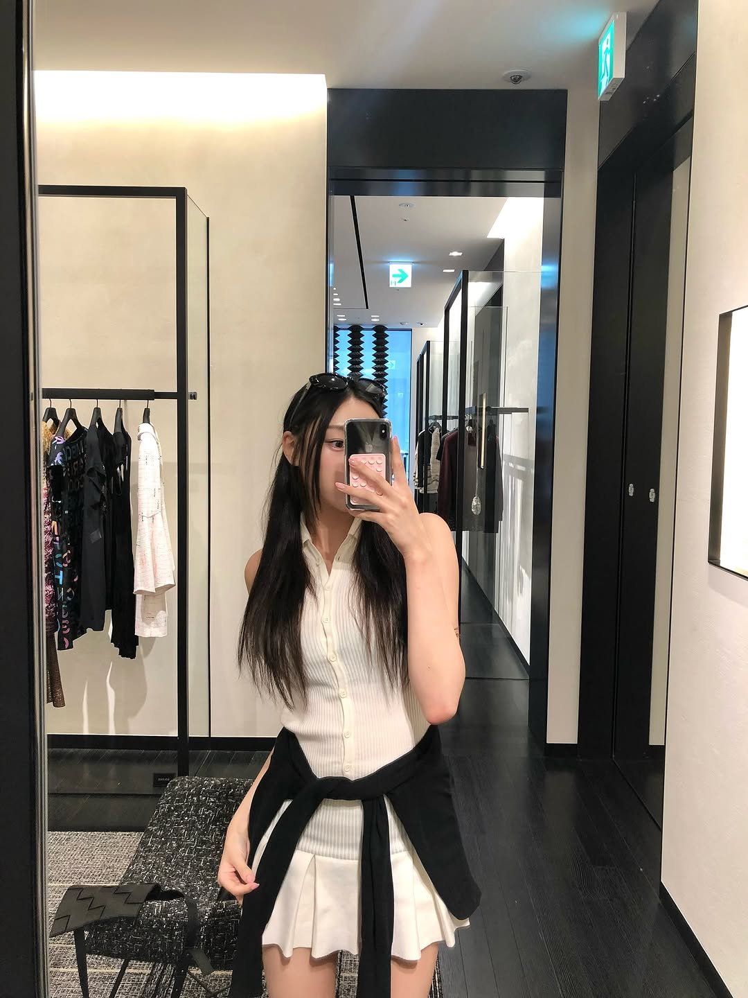 Photo by 장진원 JINWON on July 15, 2025. May be an image of 1 person, skirt, miniskirt, mirror and text.