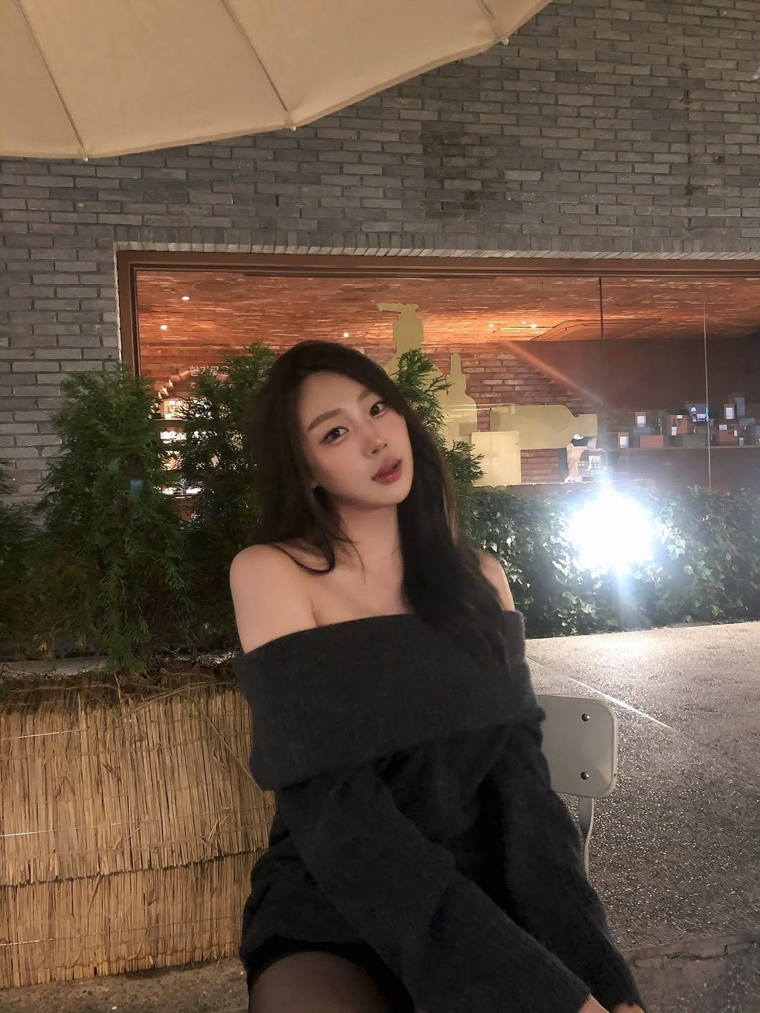 Photo by 장진원 JINWON on November 07, 2025. May be an image of one or more people, hair, top, turtleneck, night, outdoors and text.