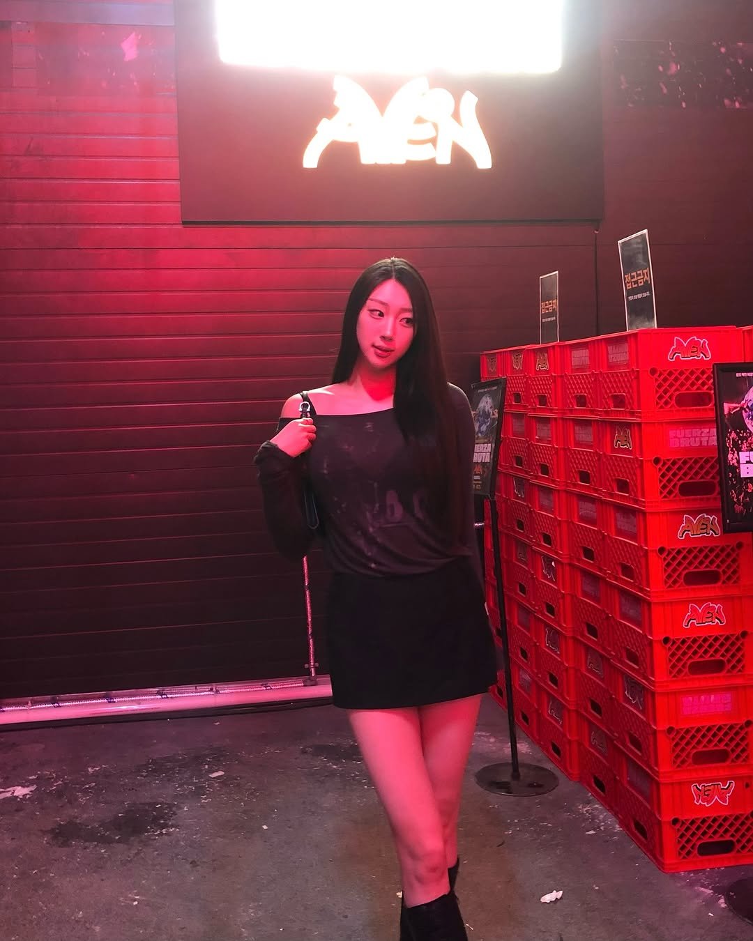 Photo by 장진원 JINWON on April 19, 2025. May be an image of 1 person, fishnet stockings, miniskirt and text.