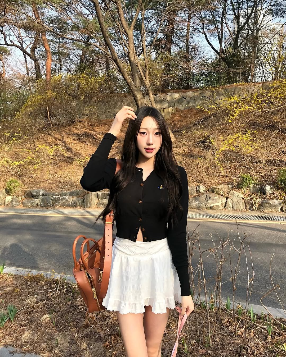 Photo by 장진원 JINWON on April 04, 2025. May be an image of 1 person, skirt, miniskirt and text.