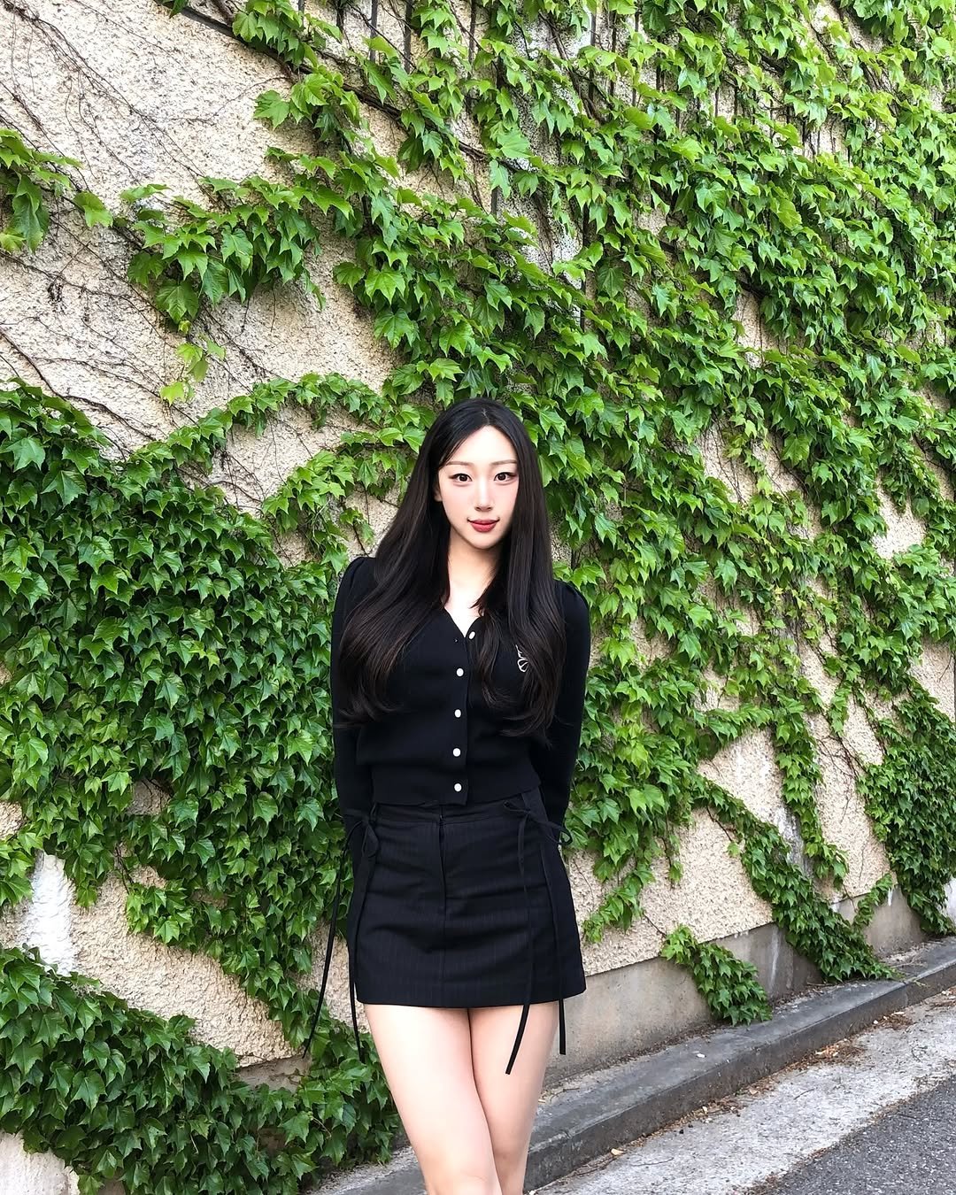 Photo by 장진원 JINWON on April 29, 2025. May be an image of 1 person, miniskirt, blazer, ivy and text.