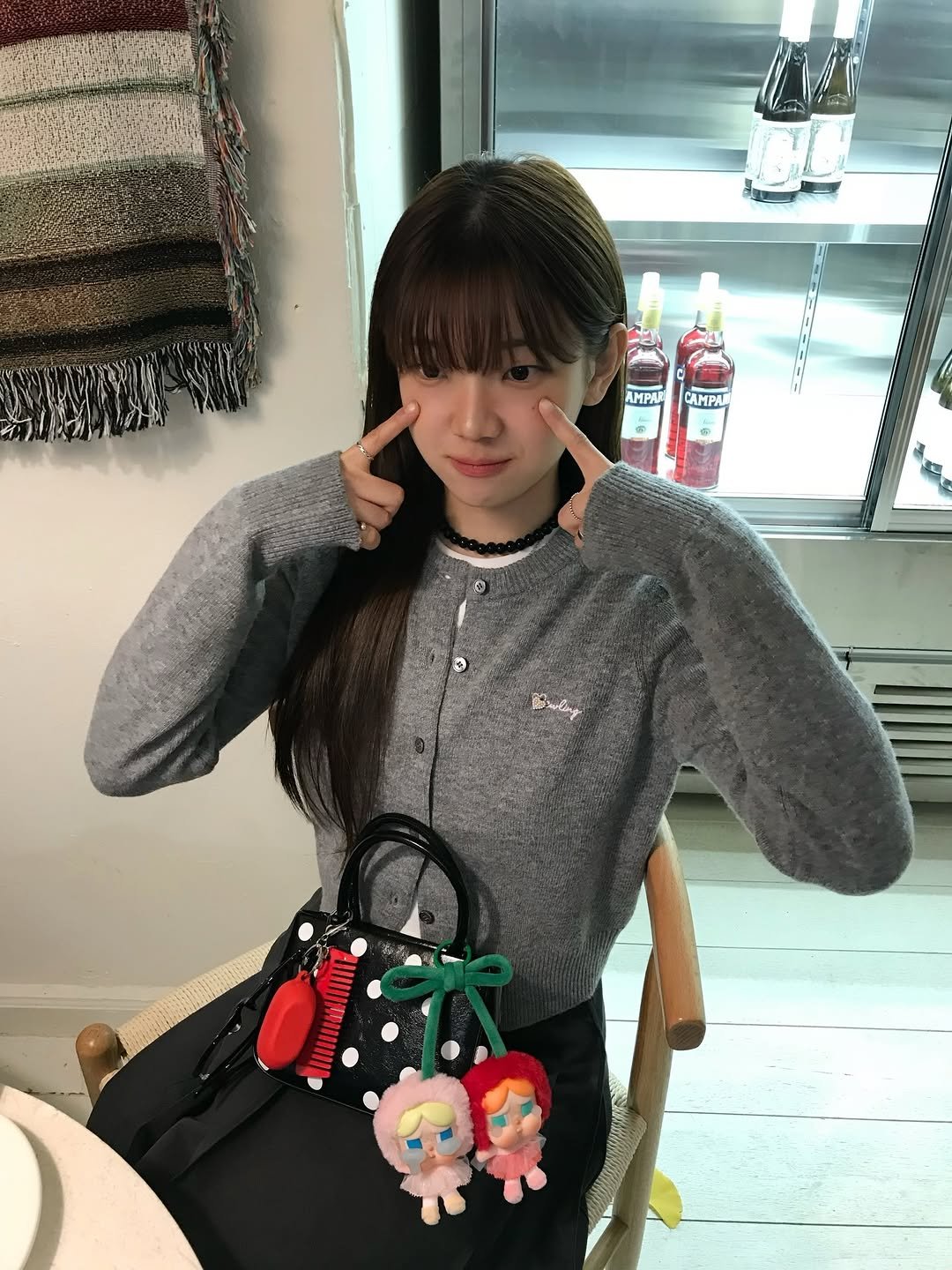 Photo shared by 오제 on December 08, 2025 tagging @popmart_korea, and @kream.co.kr. May be an image of duffle coat, purse, knit and text that says 'AMPAR CAMPAI 3 Buling W7'.