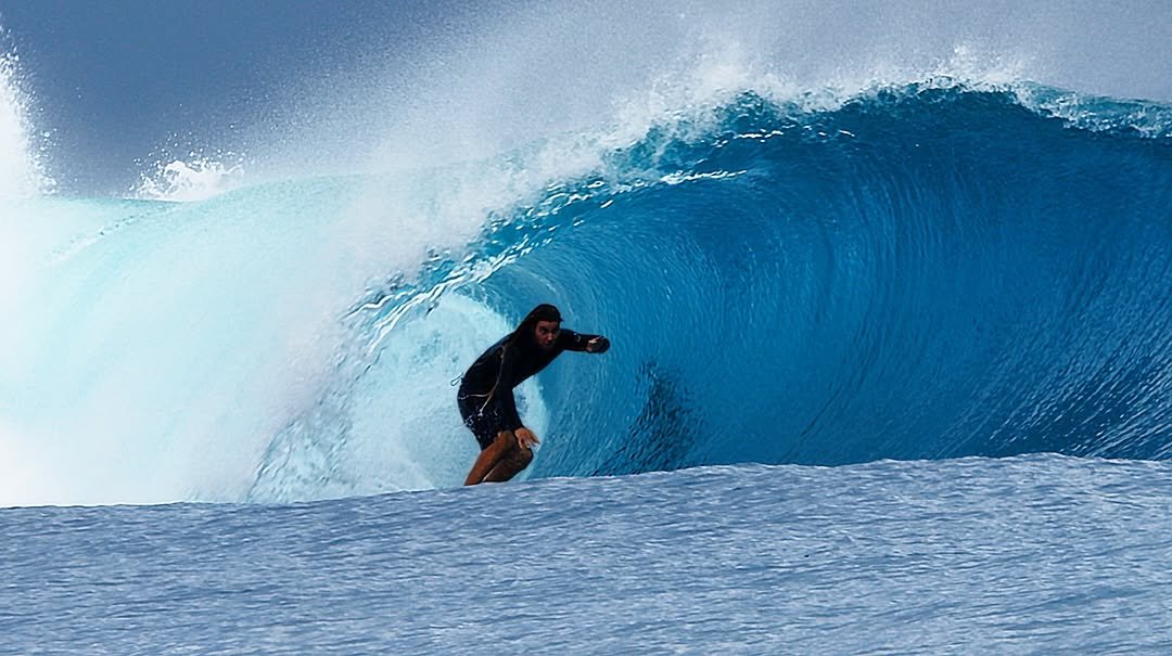 Photo shared by Oscar Langburne on March 25, 2026 tagging @ripcurl, @ripcurl_indo, @christensonsurfboards, and @agamui. May be an image of surfboard, wetsuit, water, ocean and text.