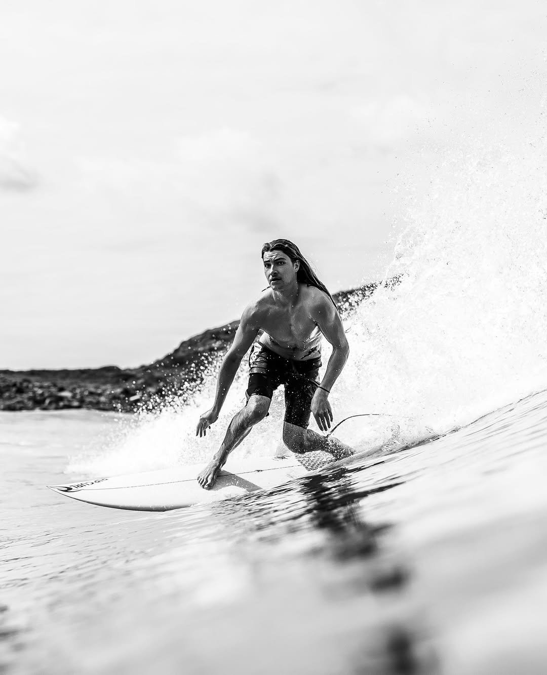 Photo shared by Rip Curl on January 06, 2026 tagging @oscar.langburne. May be a black-and-white image of surfboard, wetsuit, ocean and text.