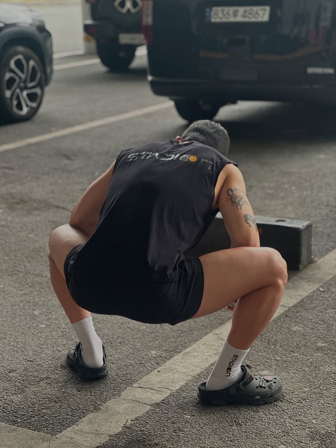 Photo by Walking Legacy on July 15, 2025. May be an image of 1 person, practicing yoga, street and text.