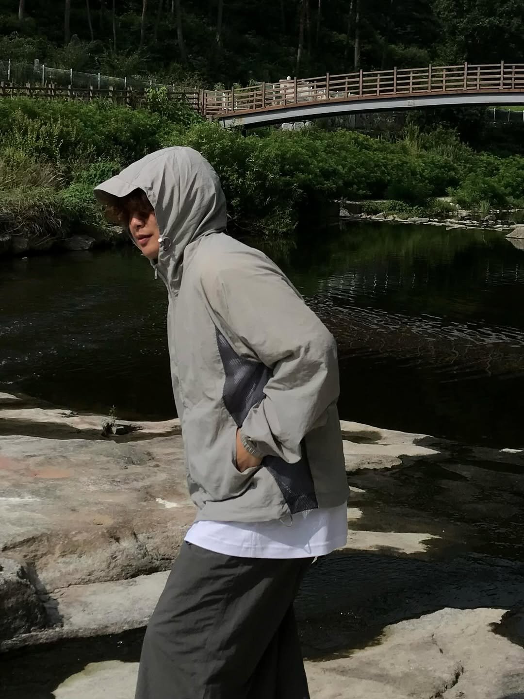 Photo shared by 오윤택/오태기 on August 05, 2025 tagging @ohtaeki_official. May be an image of 1 person, headscarf, overcoat, cloak, raincoat, sweatpants, sarong, parka, outdoors and text.