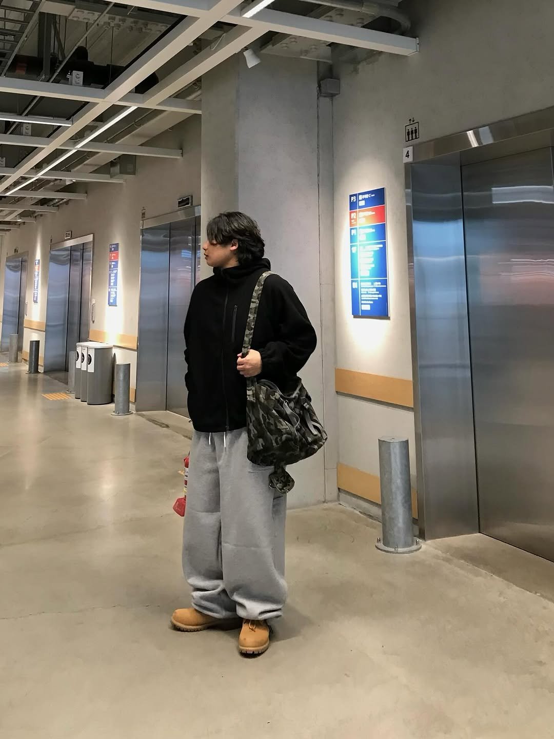 Photo shared by 오윤택/오태기 on December 15, 2025 tagging @ohtaeki_official. May be an image of standing, turnstile, wingtip shoes, sling, sweatpants, sweatsuit, parka and text.